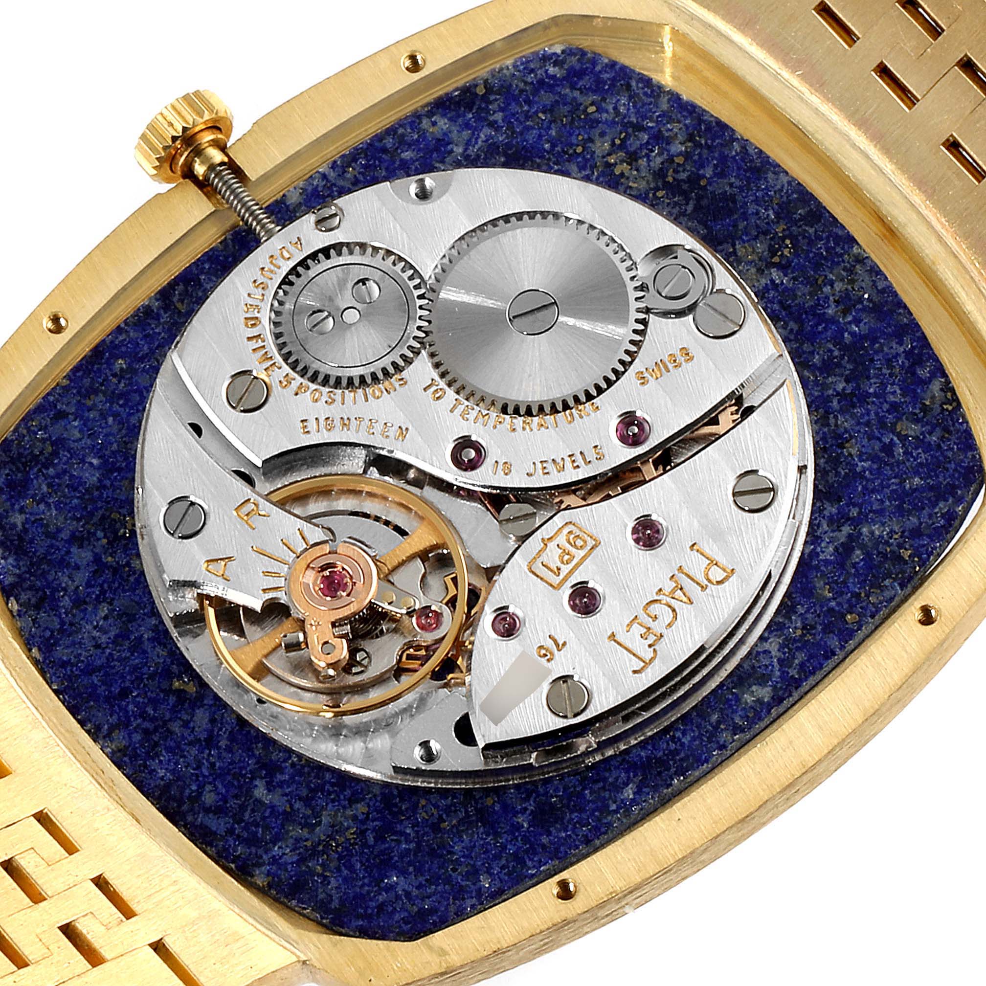 The image shows the back of the Piaget Men's Yellow Gold Blue Dial Men's Yellow Gold Blue Dial 18k Yellow Gold Blue Lapis Lazuli Stone Dial Vintage Mens Watch, highlighting its mechanical movement.