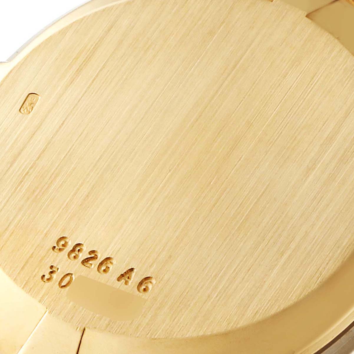 This image shows the back casing of the Piaget 9826-A-6 Women's Yellow Gold Brown Dial 9826-A-6 Women's Yellow Gold Brown Dial 9826 model watch, highlighting its yellow gold material and engraved model number.