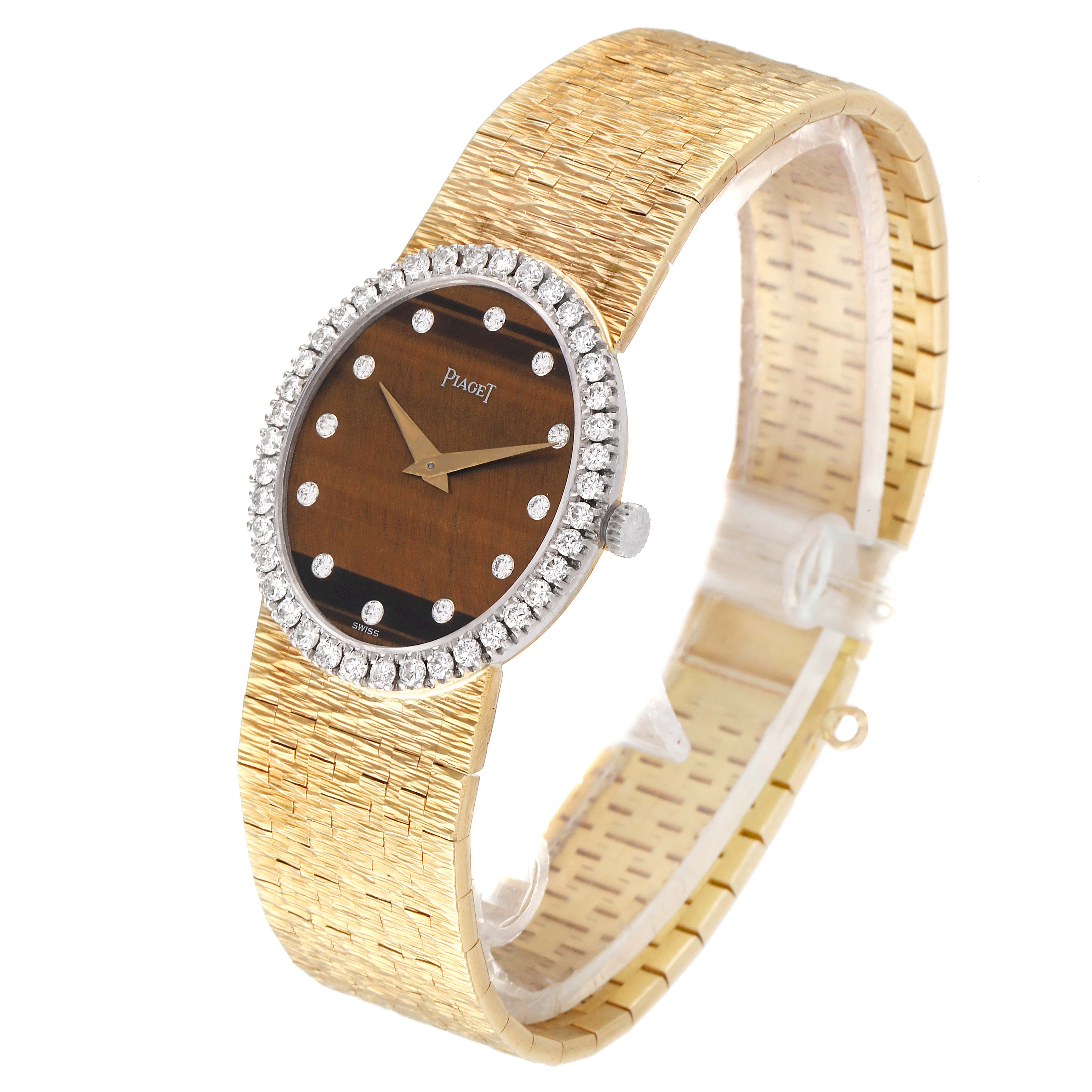 The Piaget 9826-A-6 Women's Yellow Gold Brown Dial 9826-A-6 Women's Yellow Gold Brown Dial 9826 Yellow Gold Diamond Tiger Eye Stone Dial Vintage Cocktail Ladies Watch is shown at a slight side angle.