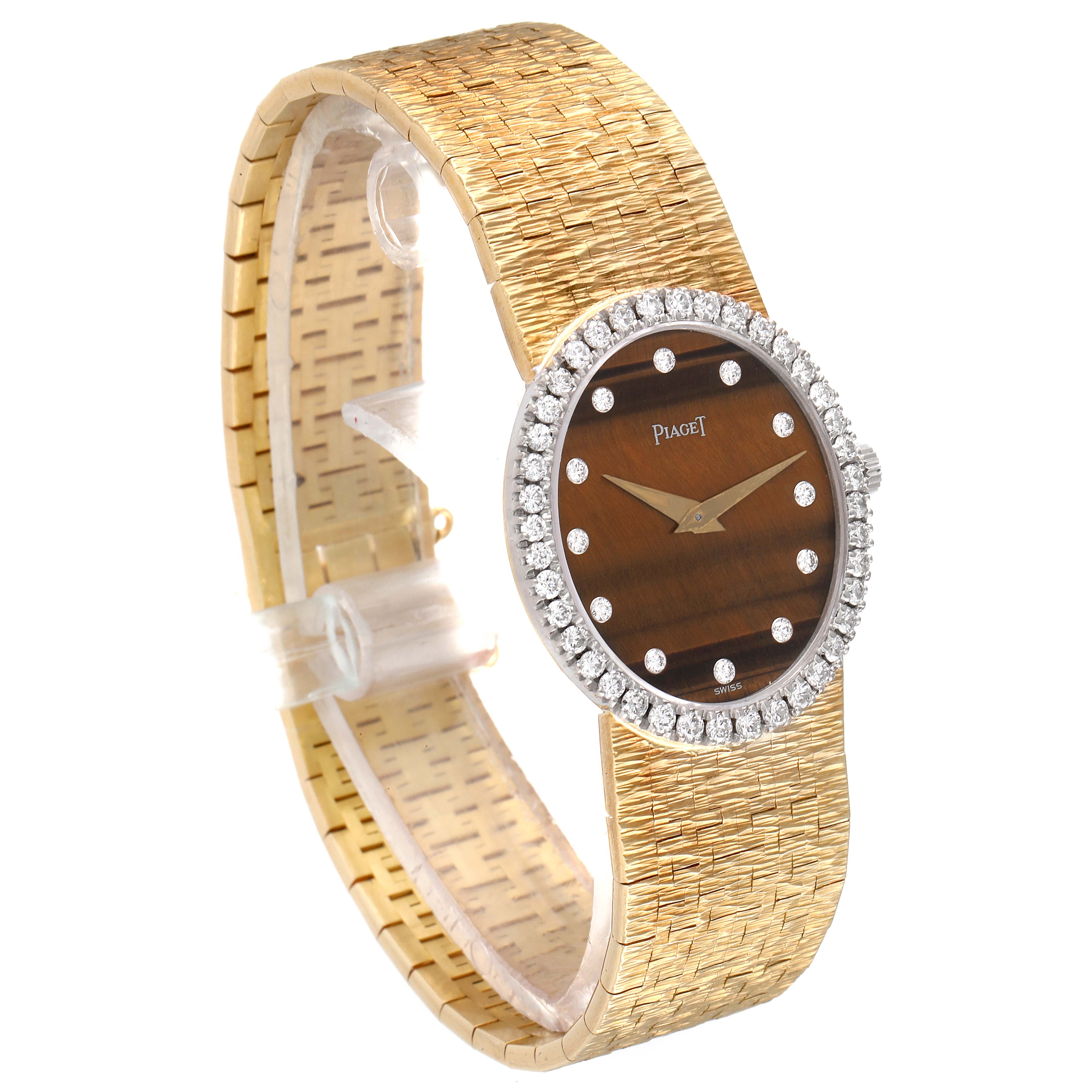 The Piaget 9826-A-6 Women's Yellow Gold Brown Dial 9826-A-6 Women's Yellow Gold Brown Dial 9826 Yellow Gold Diamond Tiger Eye Stone Dial Vintage Cocktail Ladies Watch is shown at a three-quarter angle.