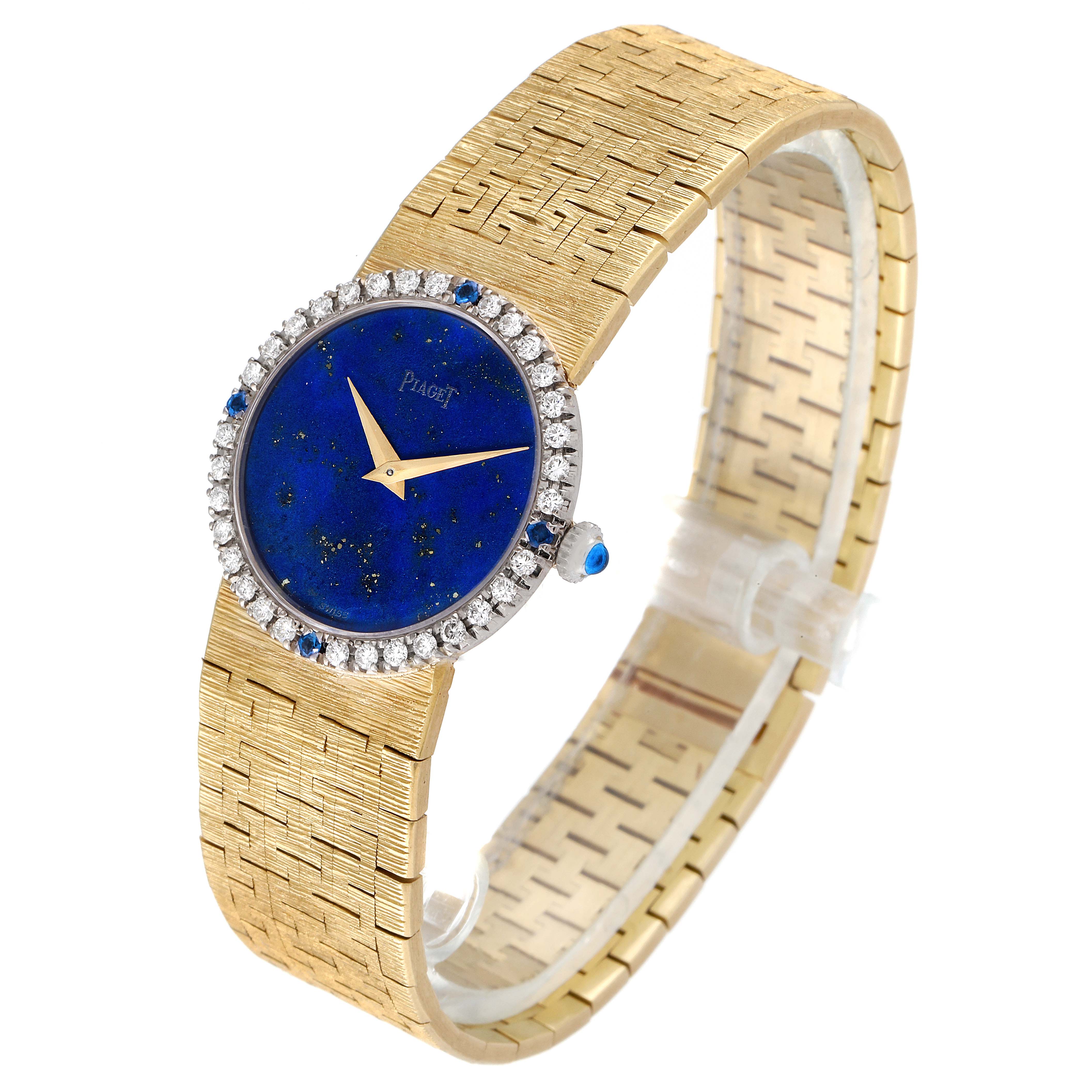 The image shows a Piaget 9706-A-6 Women's Yellow Gold Blue Dial 9706-A-6 Women's Yellow Gold Blue Dial Vintage Cocktail Watch model 9706 in yellow gold with a lapis stone dial, diamond bezel, and sapphire accents, angled from the side.