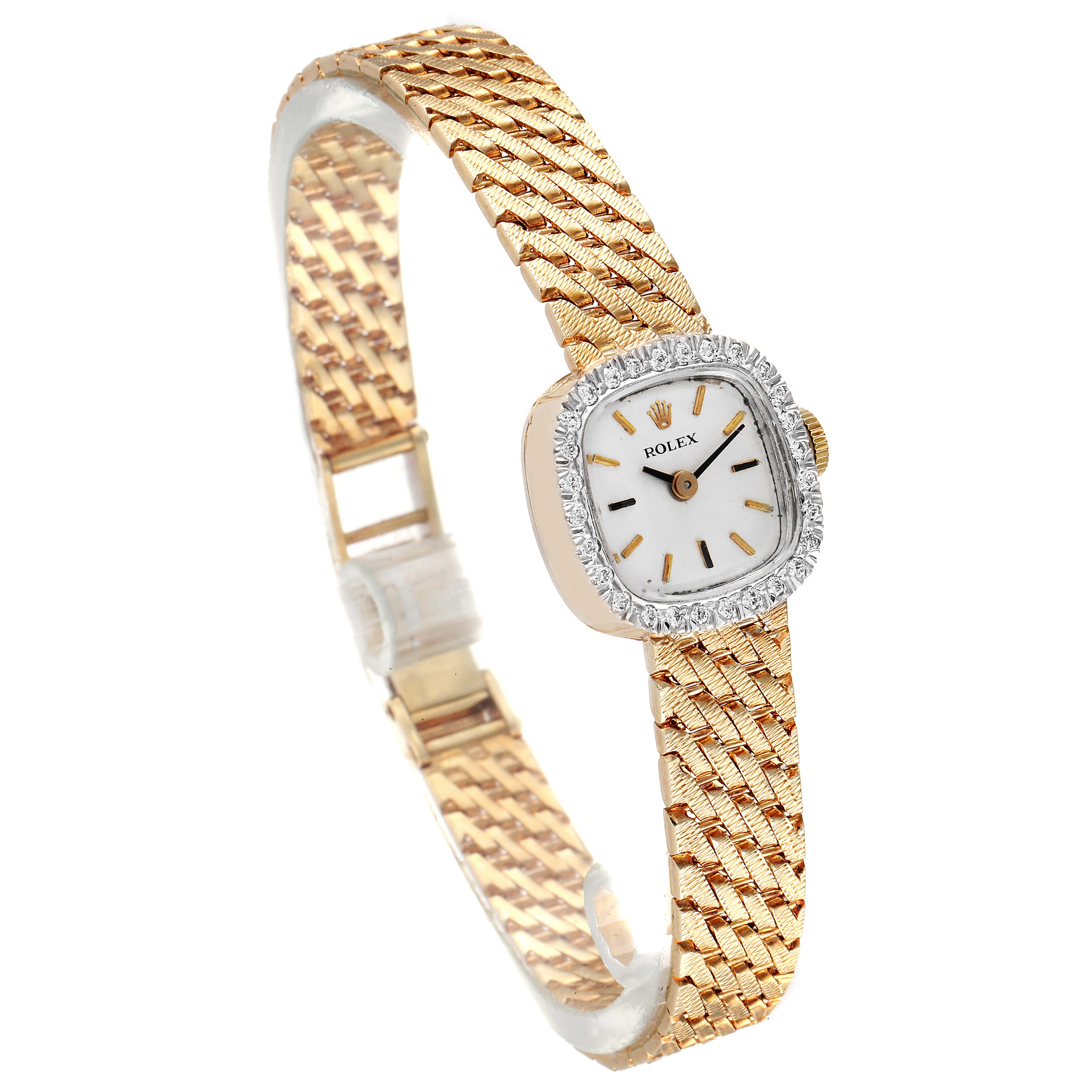 The image shows a Rolex Cocktail Women
s Yellow Gold Silver Dial Women
s Yellow Gold Silver Dial model watch at an angled perspective, highlighting its face and textured gold bracelet.
