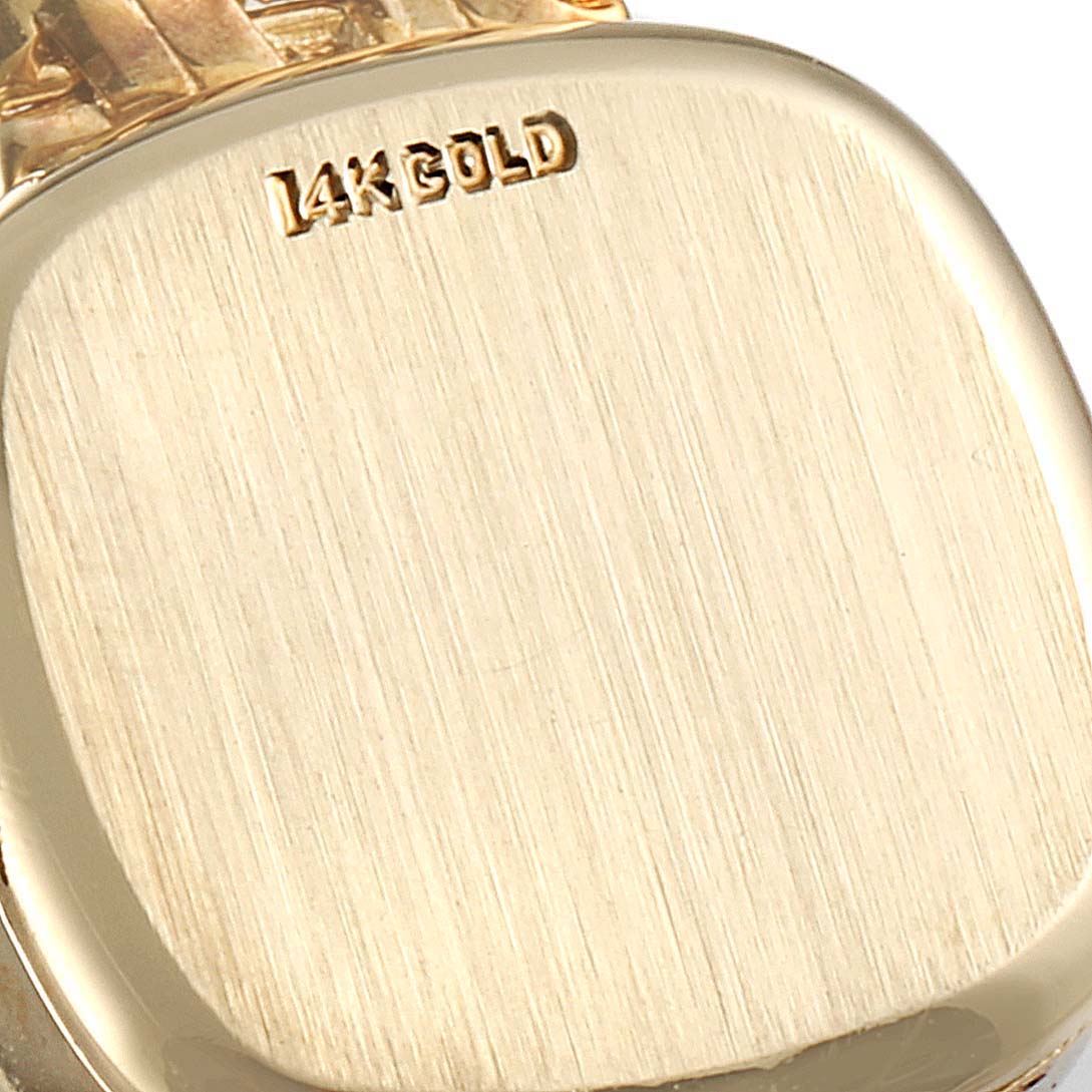 The image shows a close-up of the back case of a Rolex Cocktail Women
s Yellow Gold Silver Dial Women
s Yellow Gold Silver Dial model watch, highlighting the "14K GOLD" engraving.