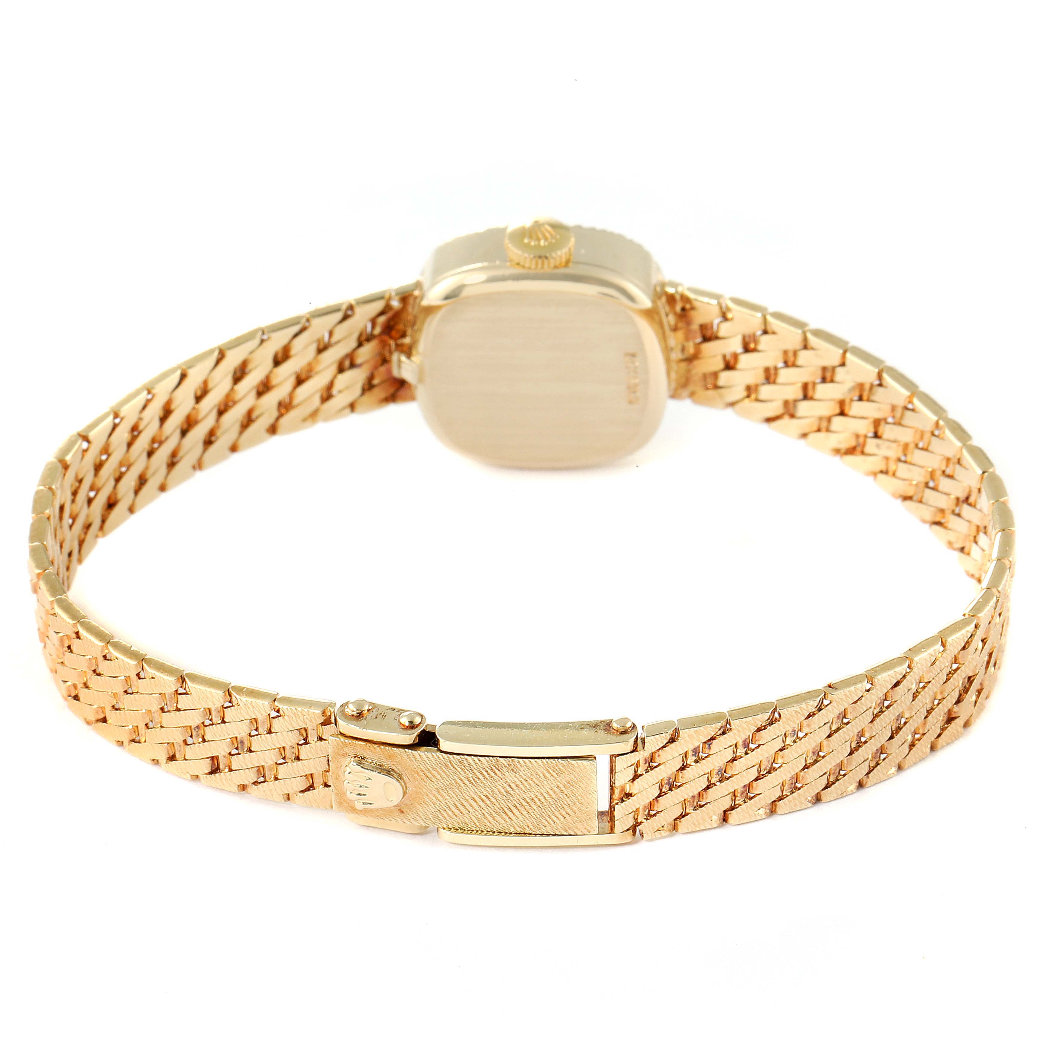 This image shows the back of the Rolex Cocktail Women
s Yellow Gold Silver Dial Women
s Yellow Gold Silver Dial model watch, featuring its gold bracelet and clasp.