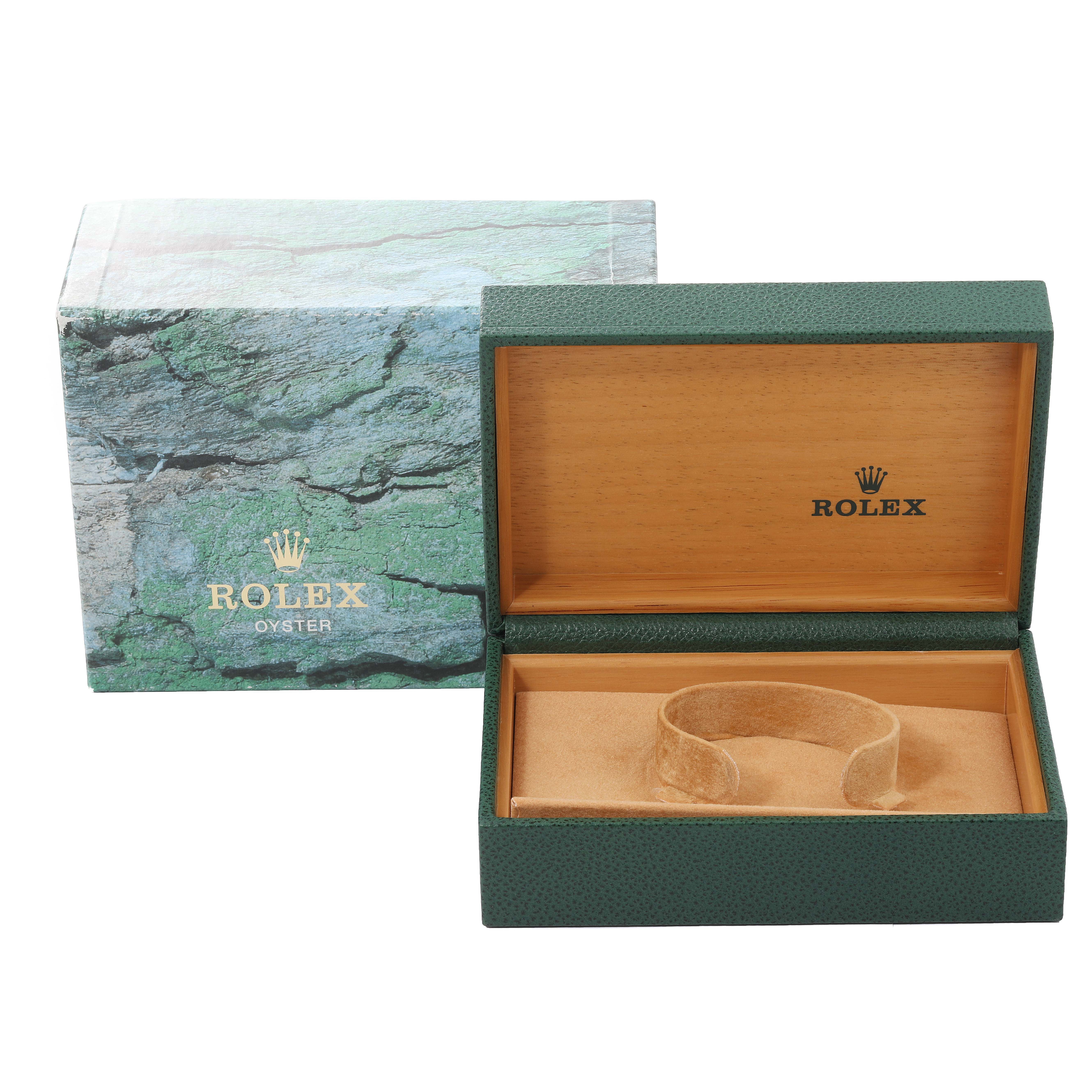 The image shows an open green Rolex box with a tan interior, and a padded insert for the Air-King model watch by Rolex.