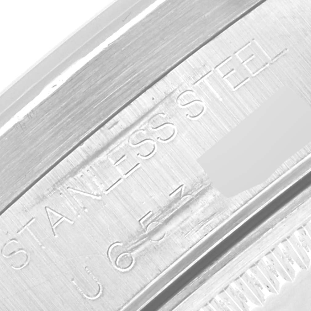 This is a close-up angle of the serial number inscription on the stainless steel case of a Rolex Air-King 14010M Men's Stainless Steel Black Dial 14010M Men's Stainless Steel Black Dial watch.