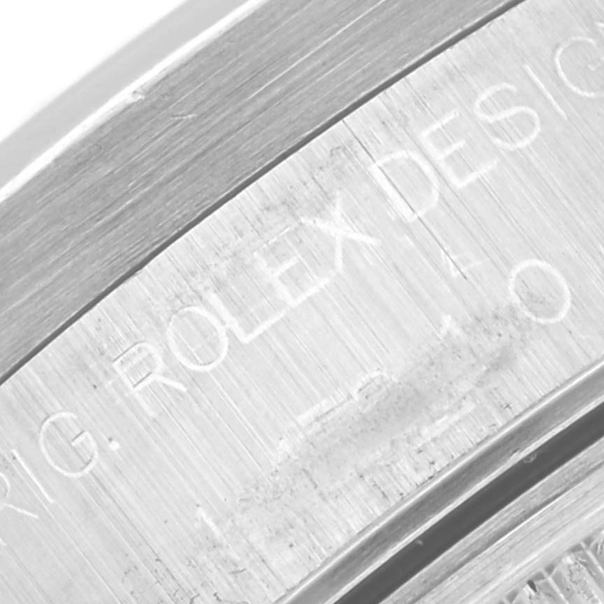 The image shows a close-up of the engravings on the brushed metal case of a Rolex Air-King 14010M Men's Stainless Steel Black Dial 14010M Men's Stainless Steel Black Dial watch.