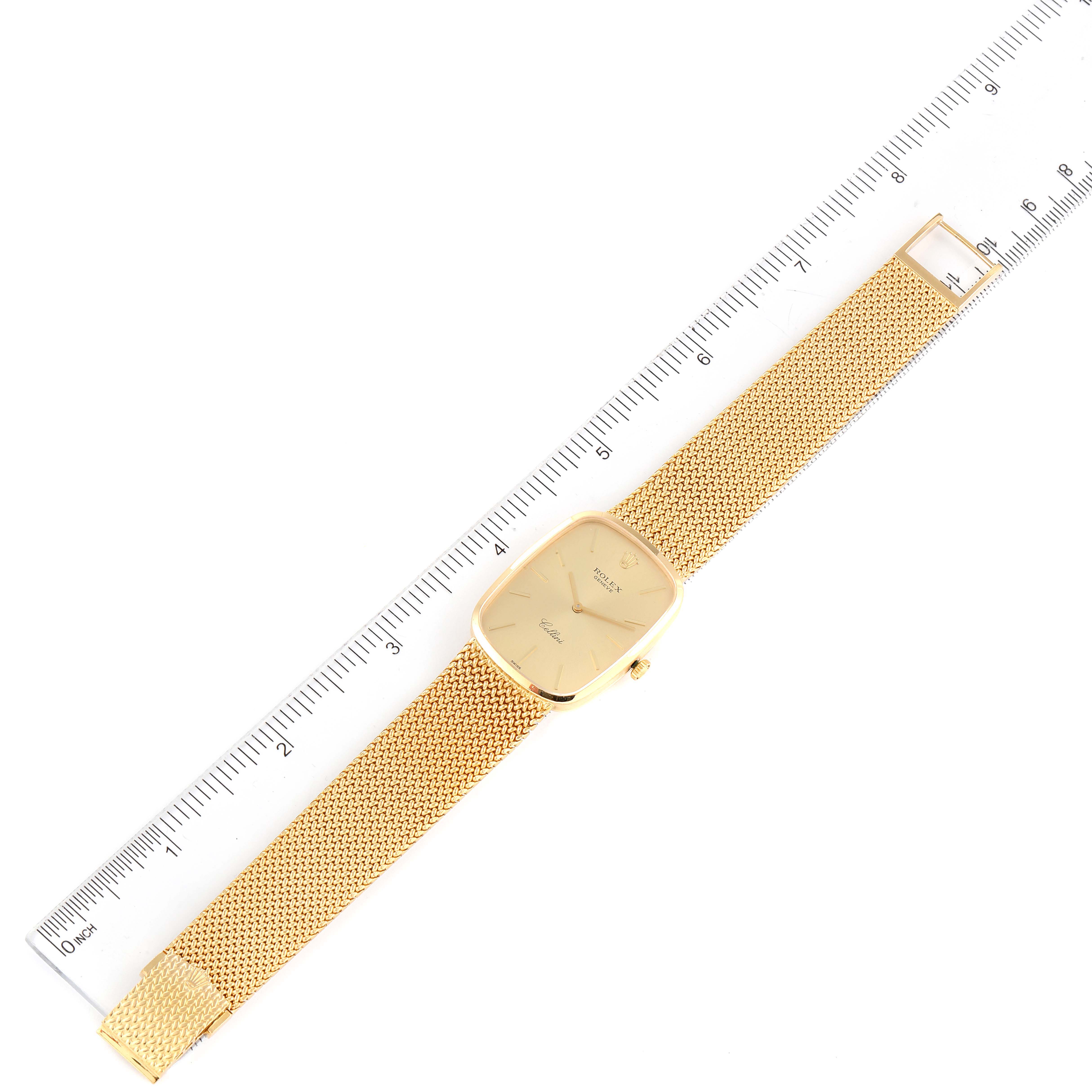 The image shows an overhead view of a gold Rolex Cellini 4310 Men's Yellow Gold Champagne Dial 4310 Men's Yellow Gold Champagne Dial watch next to a ruler for size comparison.