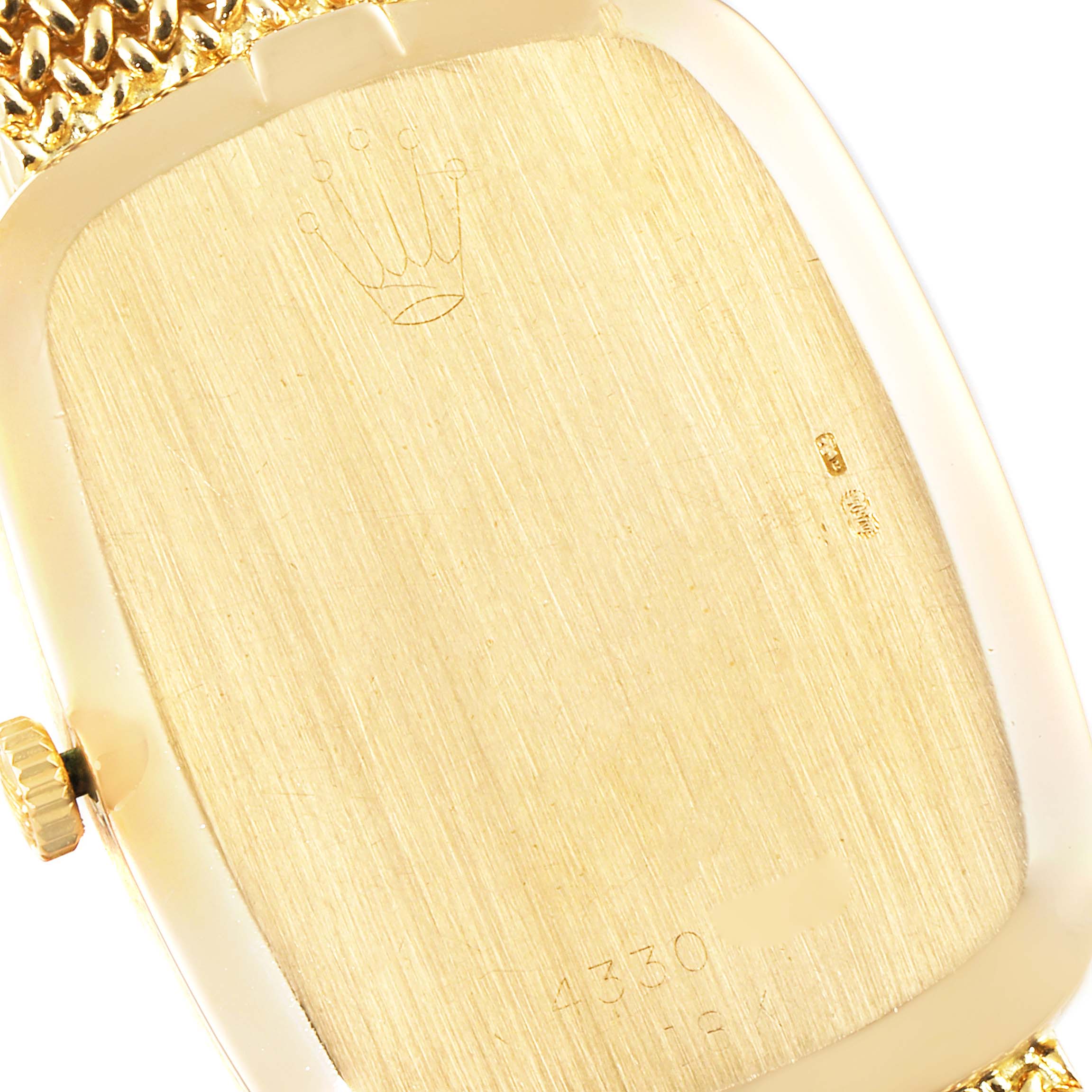 This image shows the back case of a Rolex Cellini 4310 Men's Yellow Gold Champagne Dial 4310 Men's Yellow Gold Champagne Dial watch from an angled view, including the crown and part of the band.