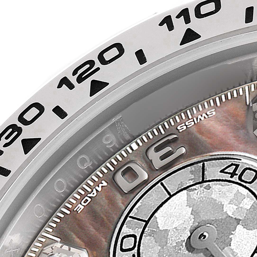 The image shows a close-up of the bezel and part of the dial of a Rolex Daytona 116509 Men's White Gold Mother of Pearl Dial 116509 Men's White Gold Mother of Pearl Dial watch, highlighting the tachymeter scale.