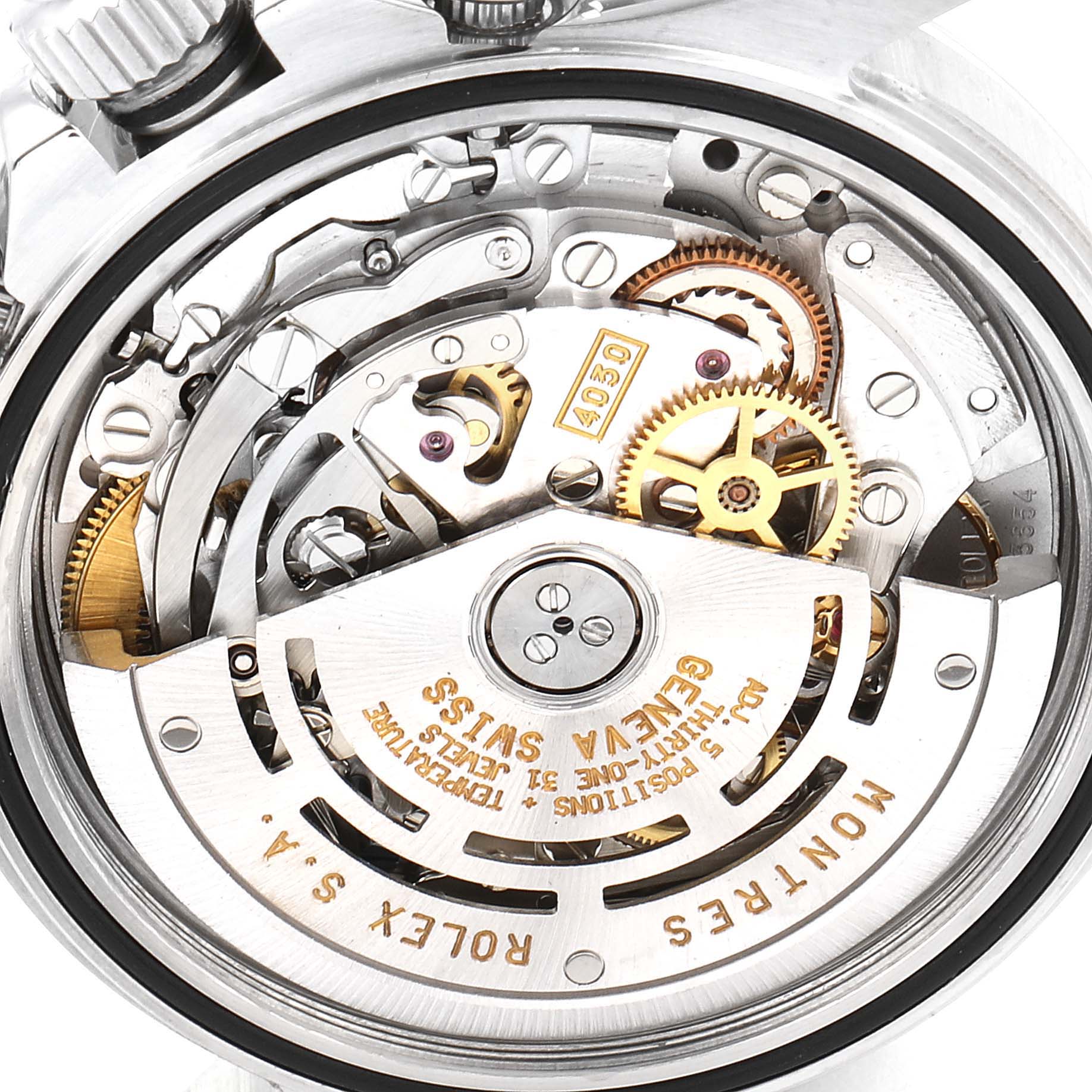 The image shows the internal mechanical movement of a Rolex Daytona 16520 Men's Stainless Steel Black Dial 16520 Men's Stainless Steel Black Dial watch, focusing on the gears and rotor.