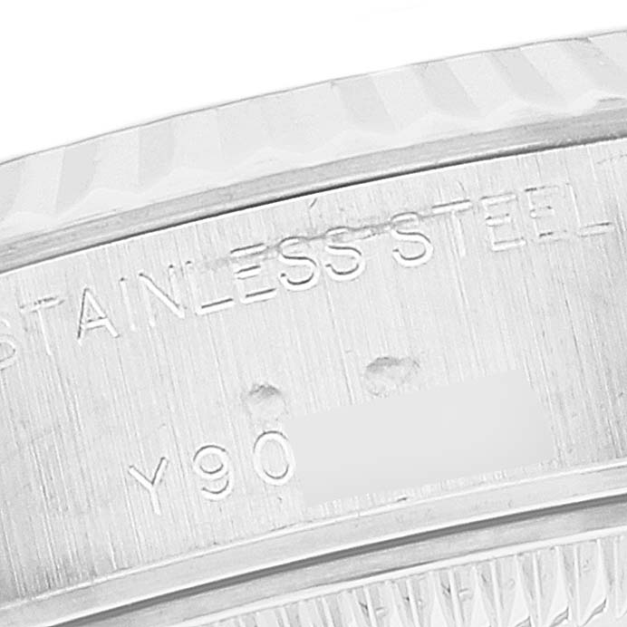 This image shows a close-up of the stainless steel case side, featuring engravings on the Rolex Datejust 79174 Women's Stainless Steel Silver Dial 79174 Women's Stainless Steel Silver Dial watch.