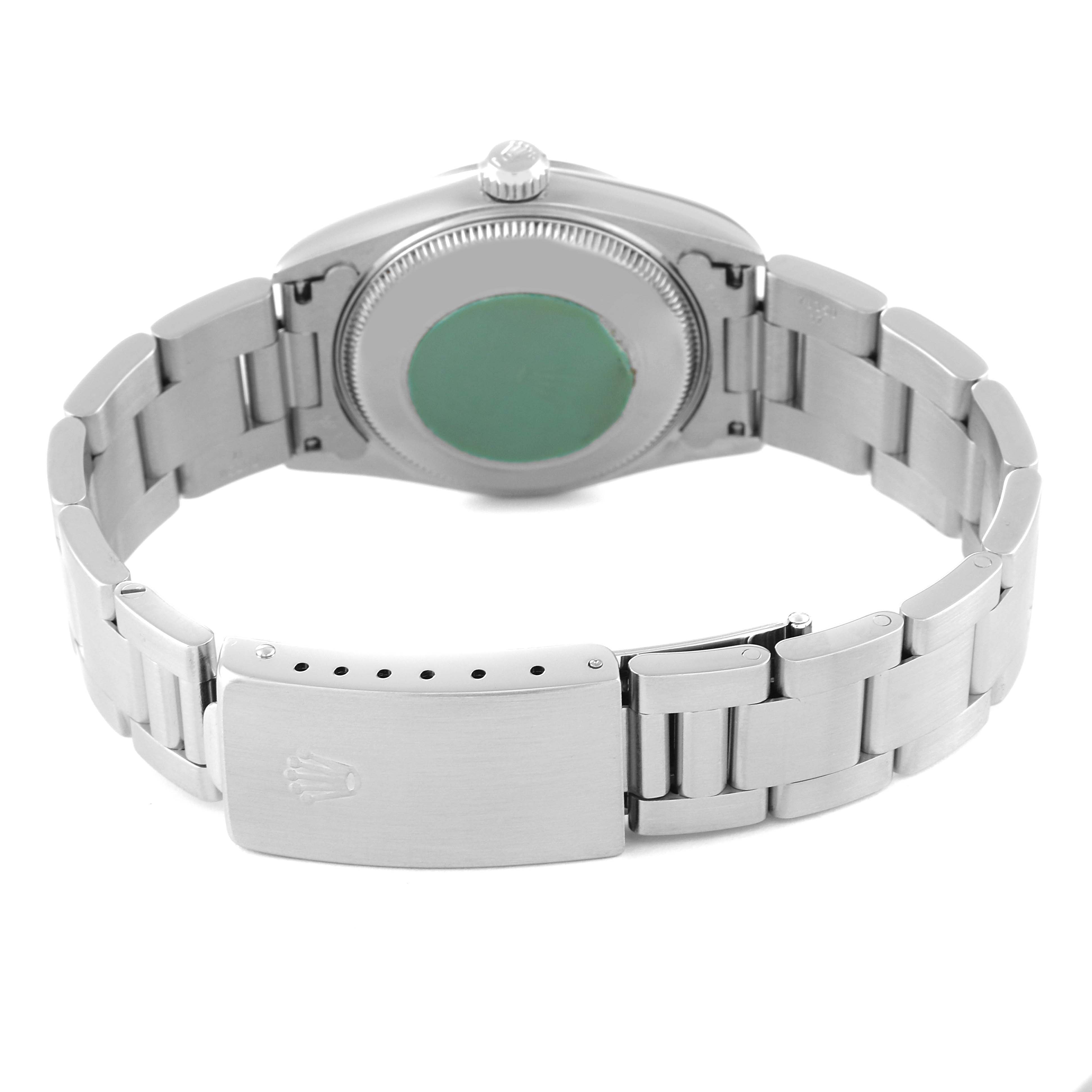 This image shows the back and bracelet clasp of a mid-size Rolex watch from a rear angle.