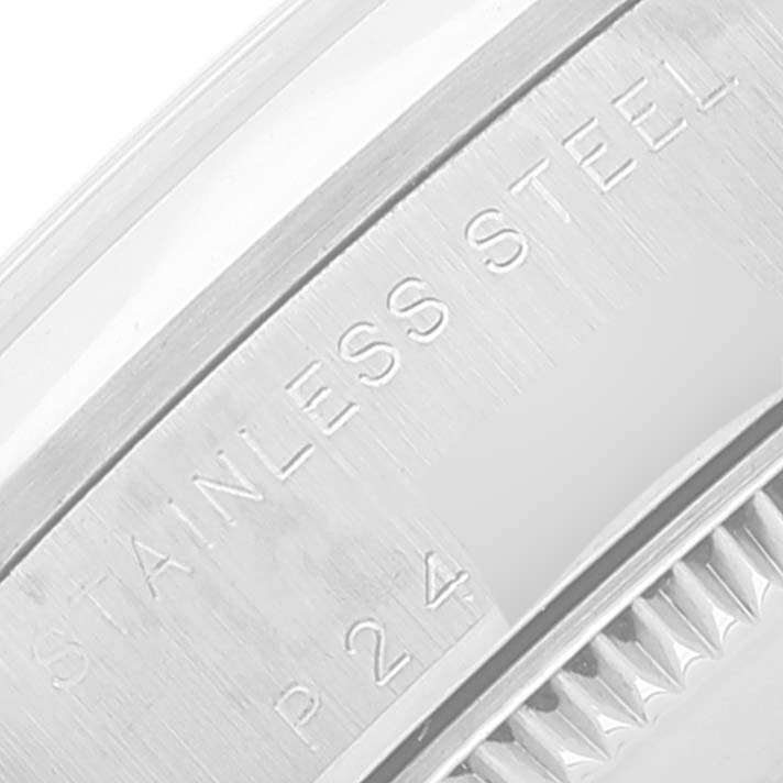 This close-up image of a Rolex Mid-Size 78240 Women
s Stainless Steel Black Dial 78240 Women
s Stainless Steel Black Dial watch shows a section of the stainless steel case back and part of the edge.