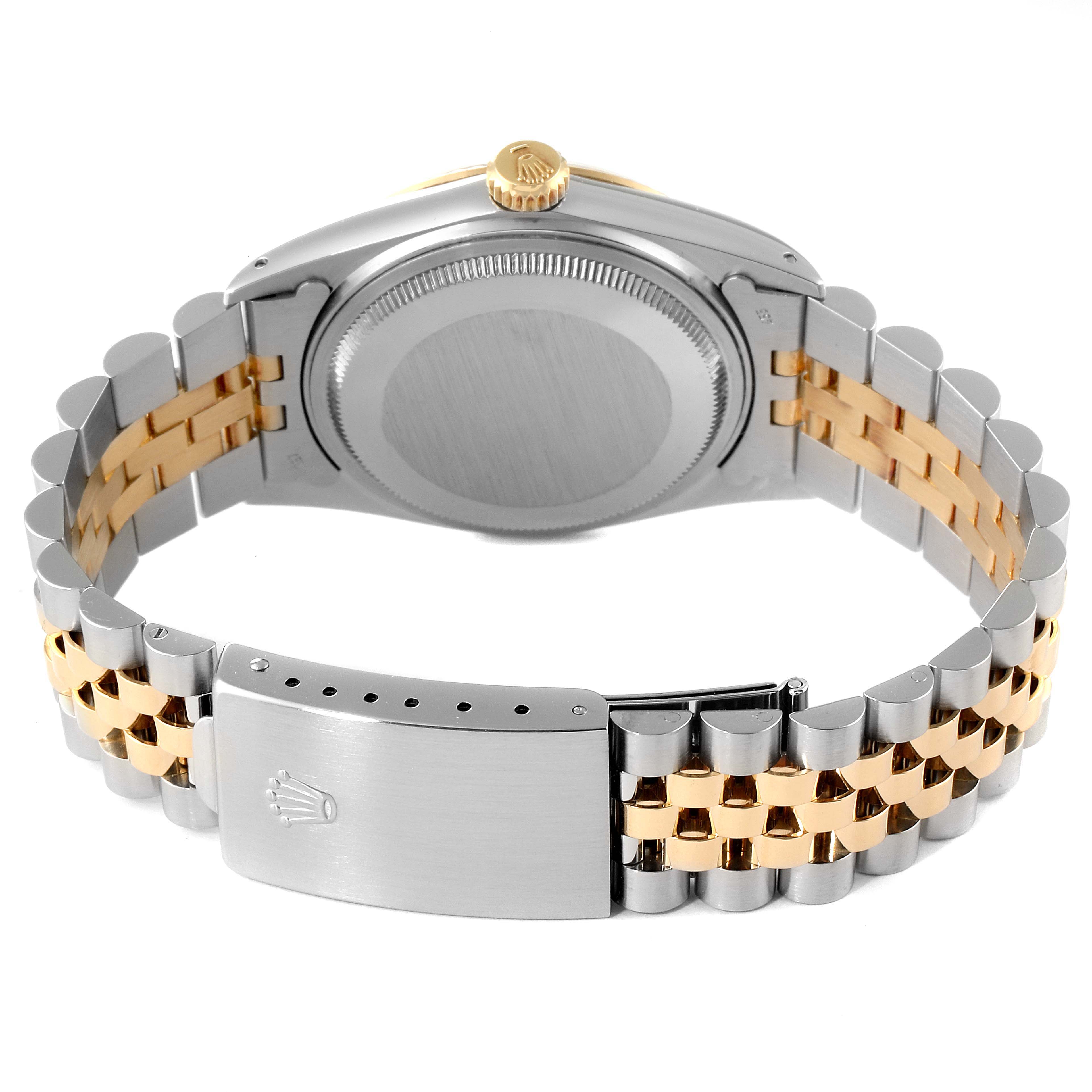 The image shows the back view of the Rolex Vintage Collection 16013 Men
s Steel and Gold (two tone) Black Dial 16013 Men
s Steel and Gold (two tone) Black Dial watch, highlighting its case, crown, and two-tone bracelet.