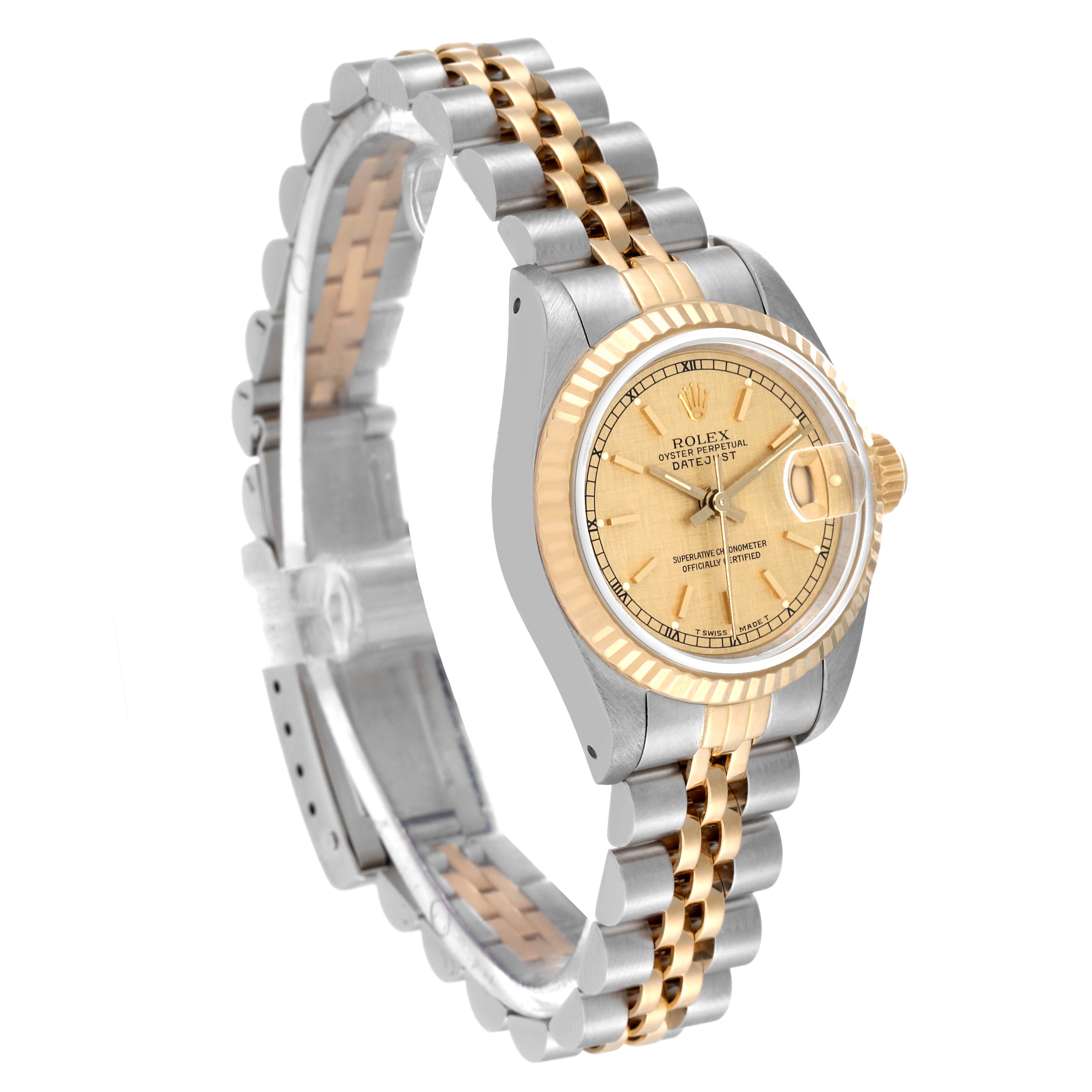 The Rolex Datejust 69173 Women's Steel and Gold (two tone) Champagne Dial 69173 Women's Steel and Gold (two tone) Champagne Dial watch is shown at an angle displaying its face, bezel, crown, and part of its two-tone bracelet.