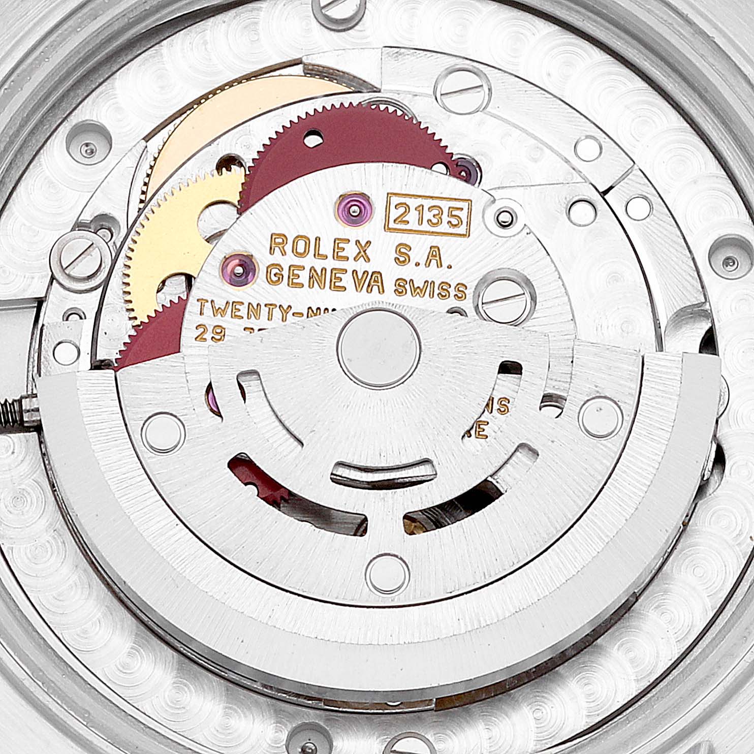 This is a close-up view showing the movement mechanism of a Mid-Size Rolex watch, focusing on the gears and inscriptions.