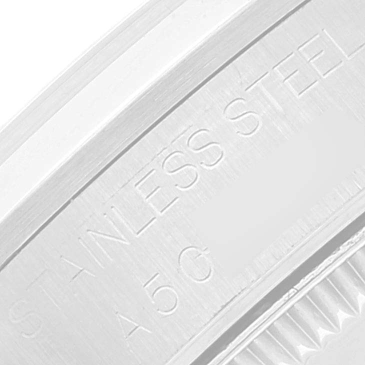 The image shows a close-up of the side of a stainless steel case from a Rolex Mid-Size 68240 Women
s Stainless Steel Blue Dial 68240 Women
s Stainless Steel Blue Dial model.