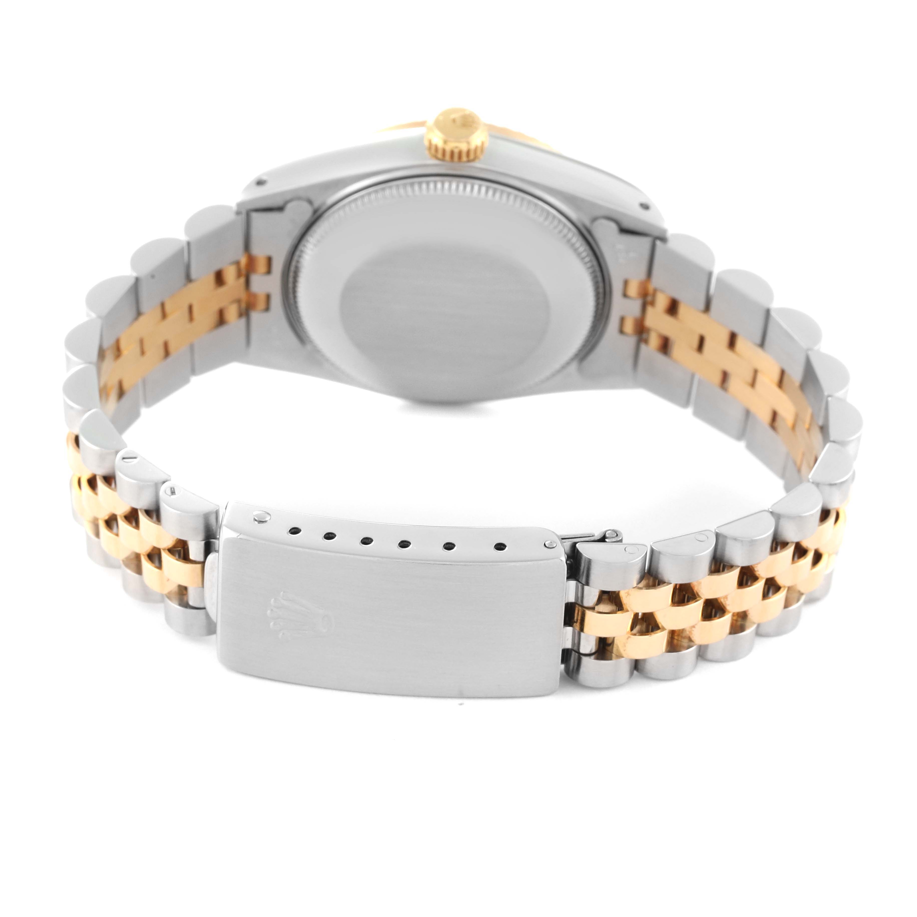 The image shows the back case, crown, and two-tone bracelet of a Mid-Size Rolex watch.