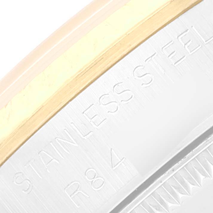 This image shows a close-up of the stainless steel and gold bezel on a Rolex Mid-Size 68273 Women
s Steel and Gold (two tone) Champagne Dial 68273 Women
s Steel and Gold (two tone) Champagne Dial watch.