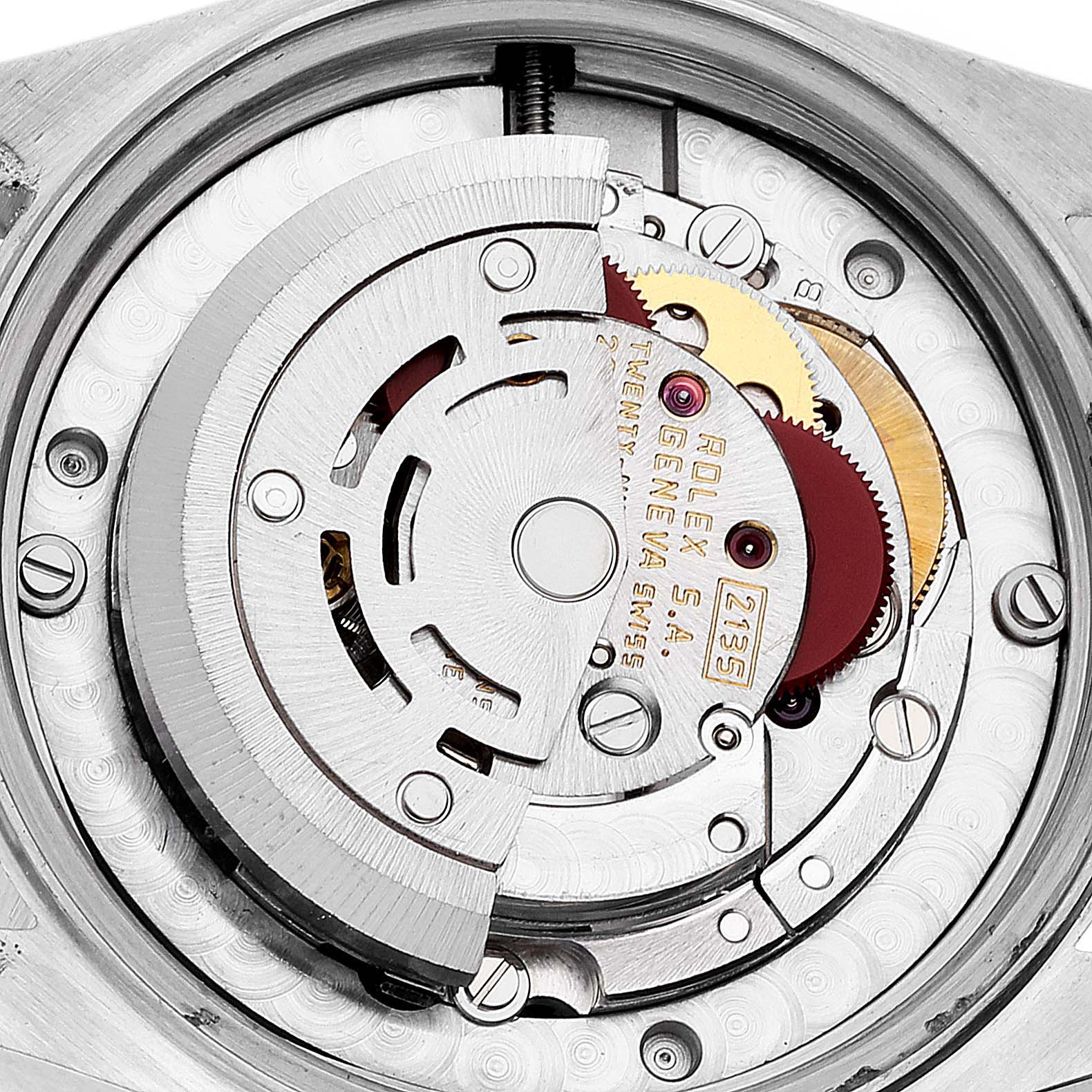This image shows a close-up view of the internal movements and gears of a Mid-Size Rolex watch.