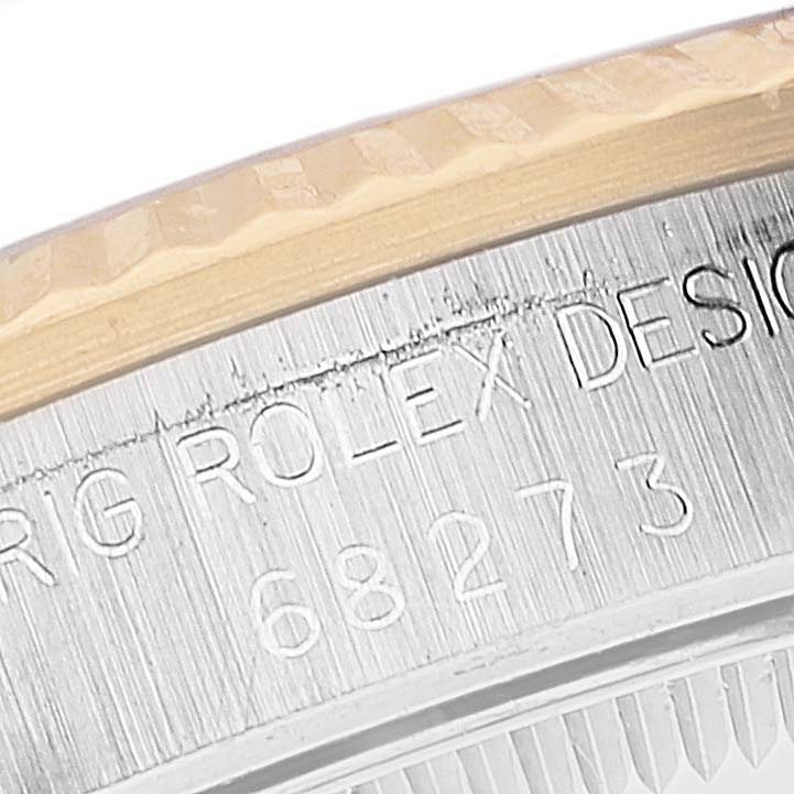 The image shows a close-up view of the bezel and engraved case reference "68273" on a mid-size Rolex model.
