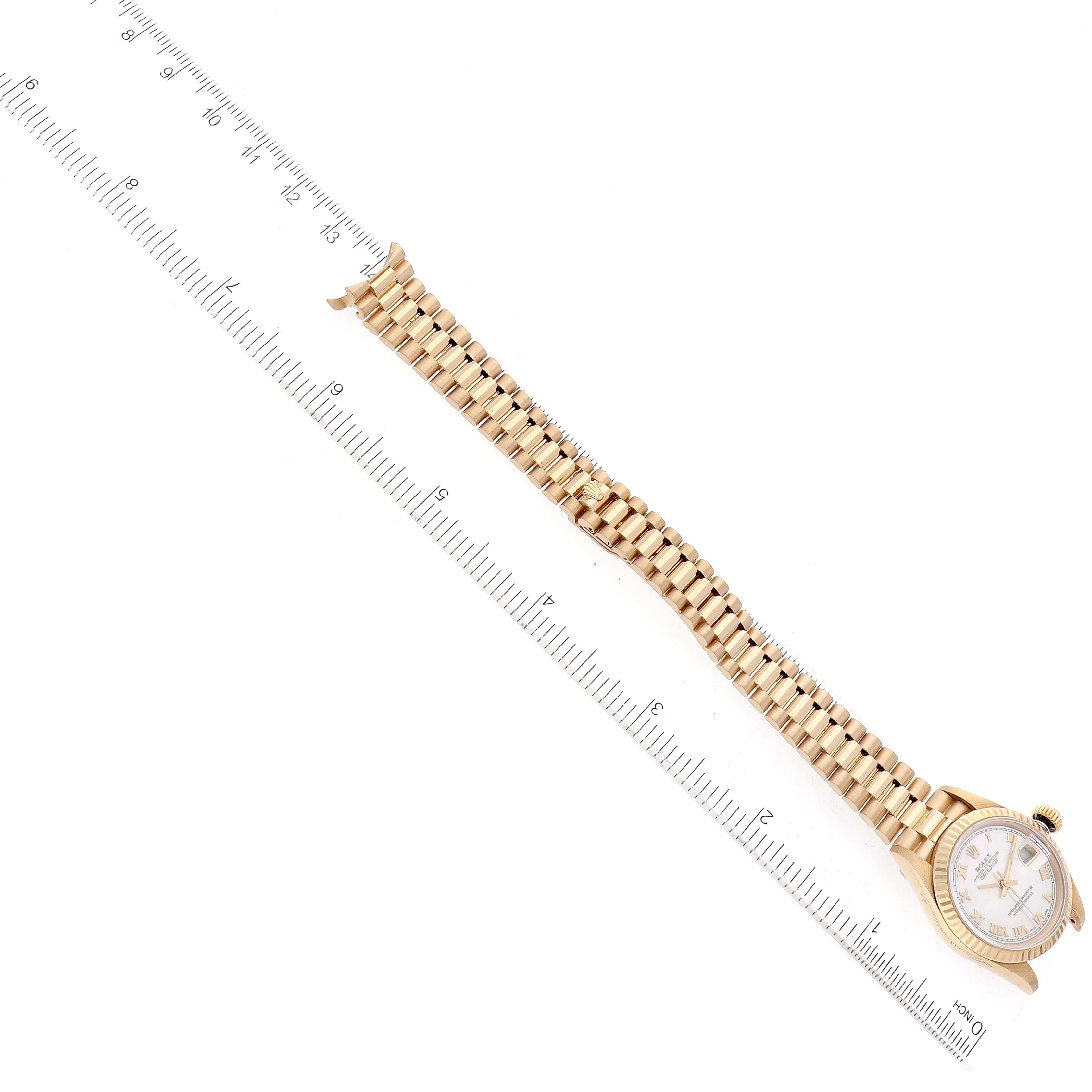 The image shows a top view of a Rolex President 69178 Women's Yellow Gold Mother of Pearl Dial 69178 Women's Yellow Gold Mother of Pearl Dial model watch, displaying the face, bezel, and full bracelet aligned with a ruler.