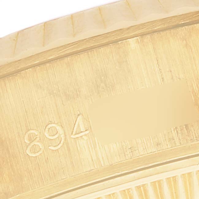 This close-up image shows part of the bezel and casing edge of a Rolex President 69178 Women's Yellow Gold Mother of Pearl Dial 69178 Women's Yellow Gold Mother of Pearl Dial model watch.