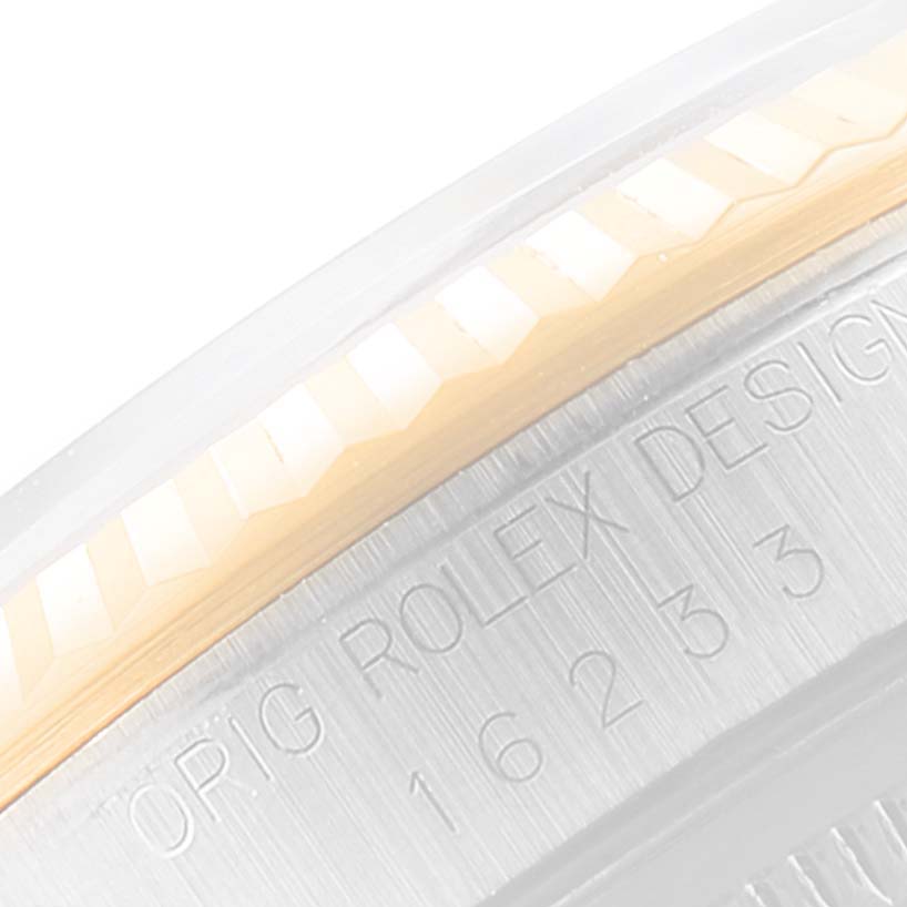 This image shows a close-up of the case side, bezel, and engraving of a Rolex Datejust 16233 Men
s Steel and Gold (two tone) Grey Dial 16233 Men
s Steel and Gold (two tone) Grey Dial watch.