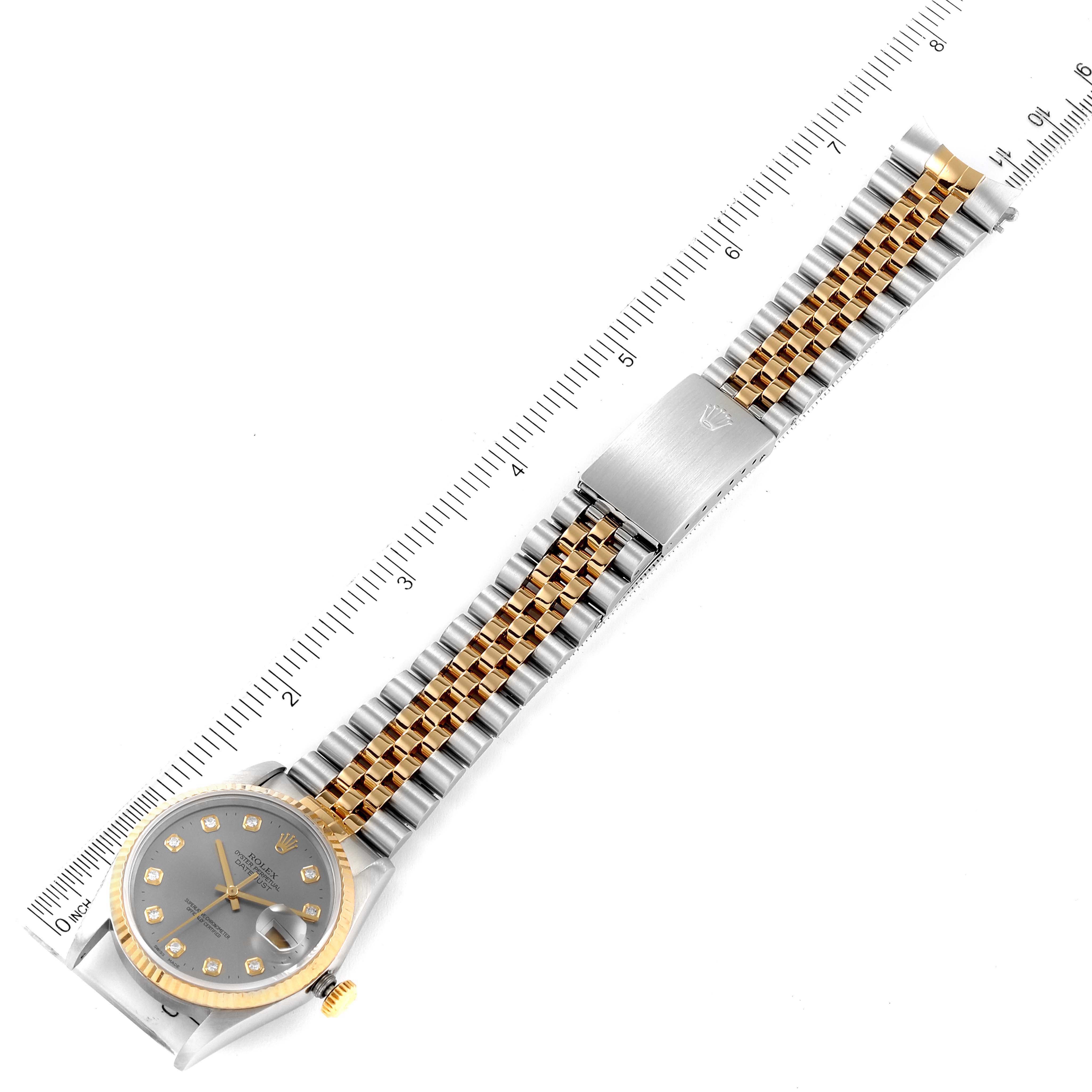 This image shows the Rolex Datejust 16233 Men
s Steel and Gold (two tone) Grey Dial 16233 Men
s Steel and Gold (two tone) Grey Dial watch laid flat with the face, bracelet, and clasp visible, measured against a ruler.