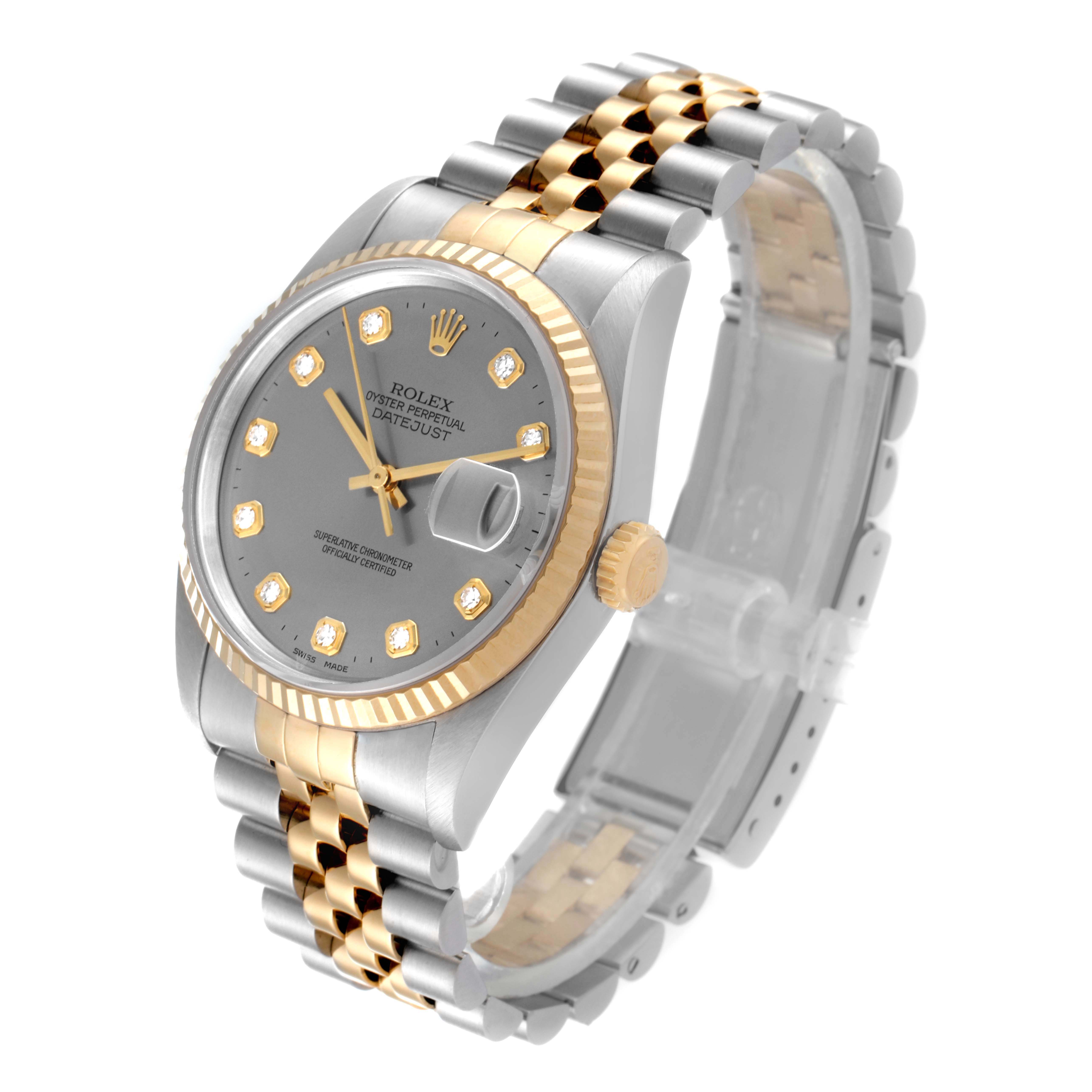 The image shows a Rolex Datejust 16233 Men
s Steel and Gold (two tone) Grey Dial 16233 Men
s Steel and Gold (two tone) Grey Dial watch at a tilted angle, highlighting its two-tone bracelet, grey dial, and gold fluted bezel.