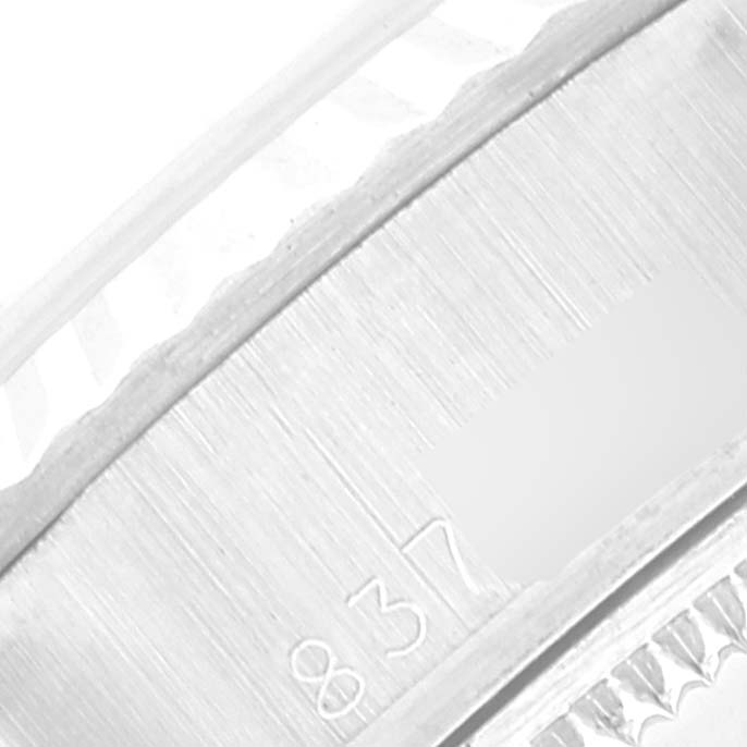 This close-up shows the engraved serial number on the inner bezel of the Rolex Date 69174 Women
s Stainless Steel Silver Dial 69174 Women
s Stainless Steel Silver Dial model watch.