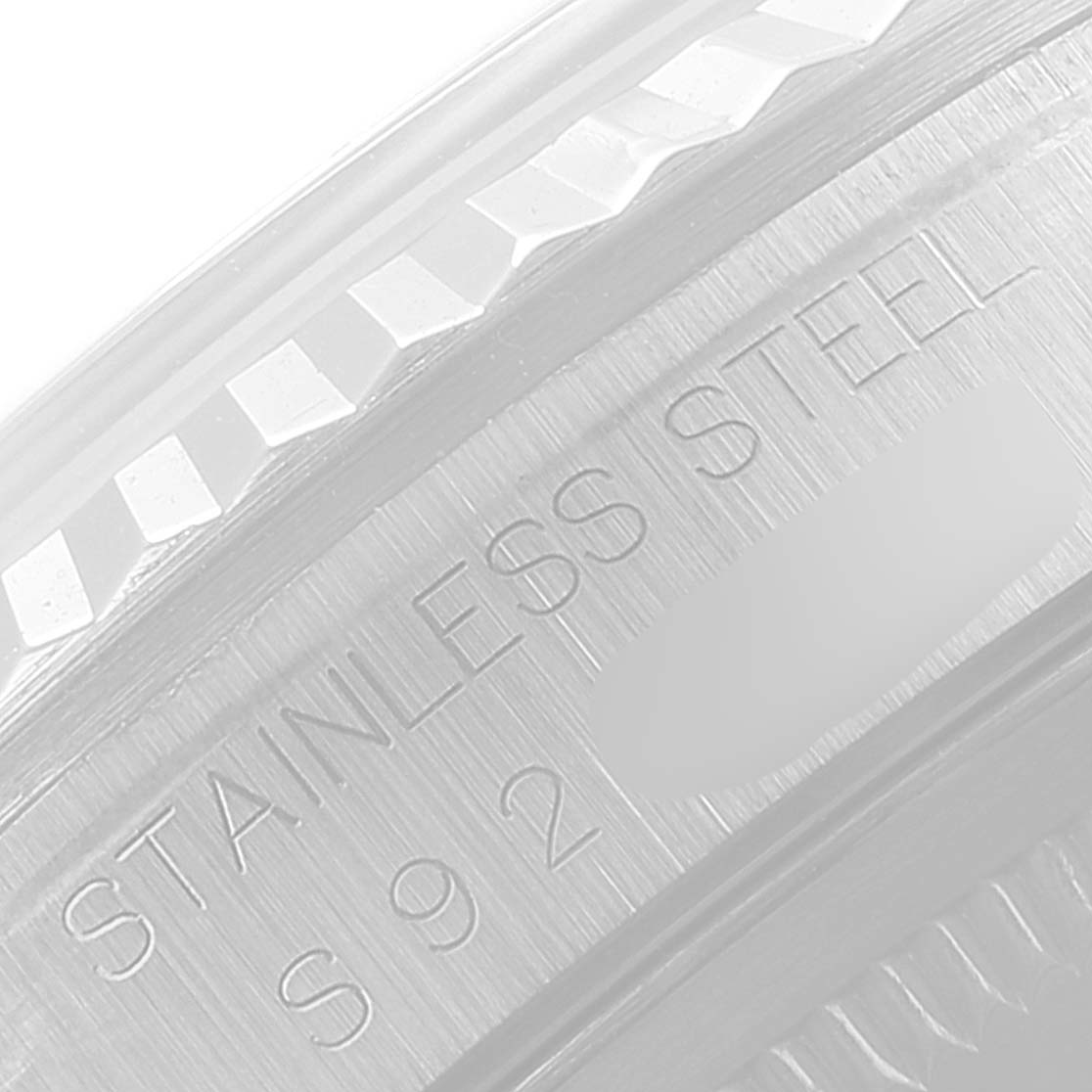 The image shows a close-up of the engraving on the stainless steel case back of a Rolex Datejust 16234 Men's Stainless Steel Silver Dial 16234 Men's Stainless Steel Silver Dial watch.
