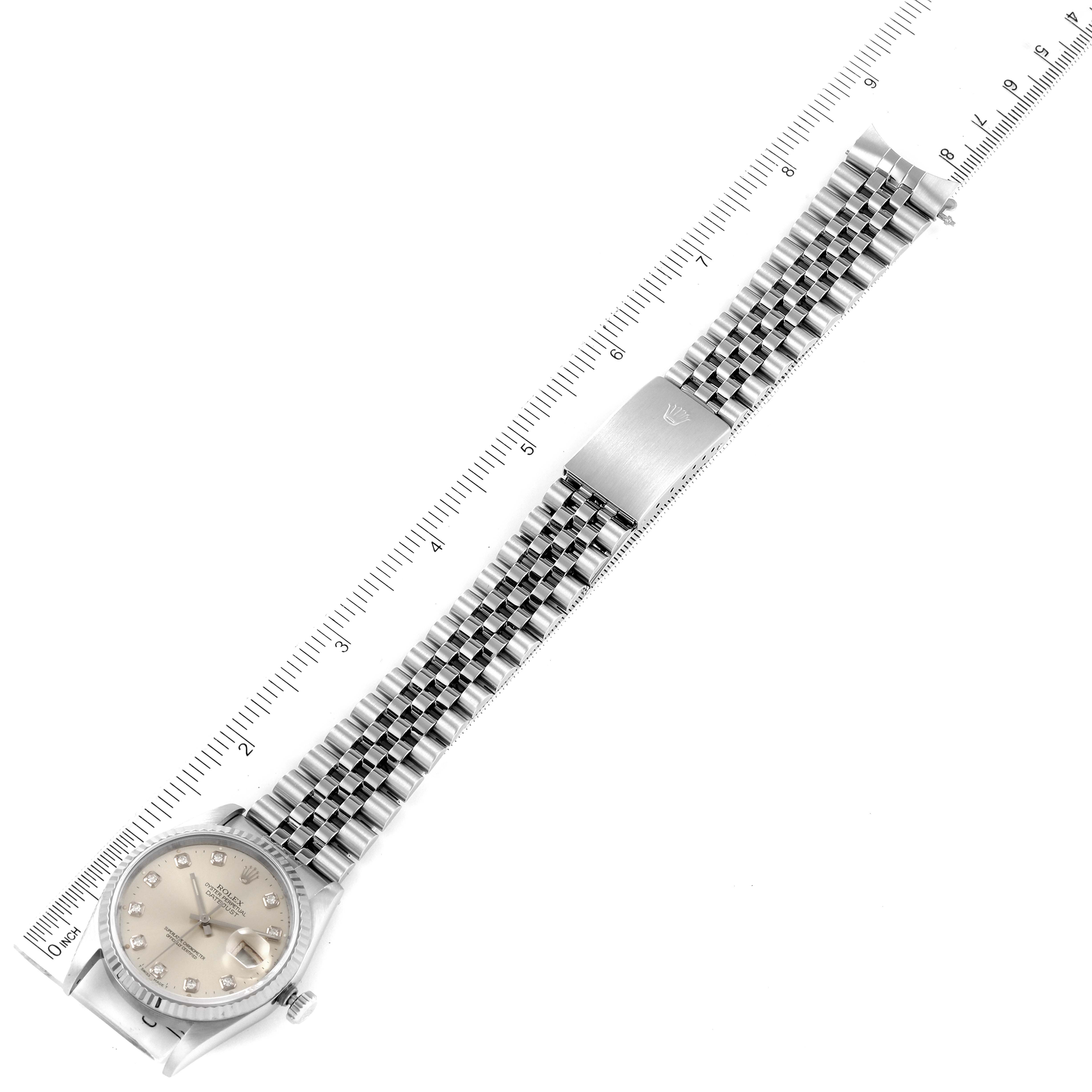 The image shows a full view of a Rolex Datejust 16234 Men's Stainless Steel Silver Dial 16234 Men's Stainless Steel Silver Dial watch, including its dial, bracelet, and clasp, placed alongside a measuring ruler.