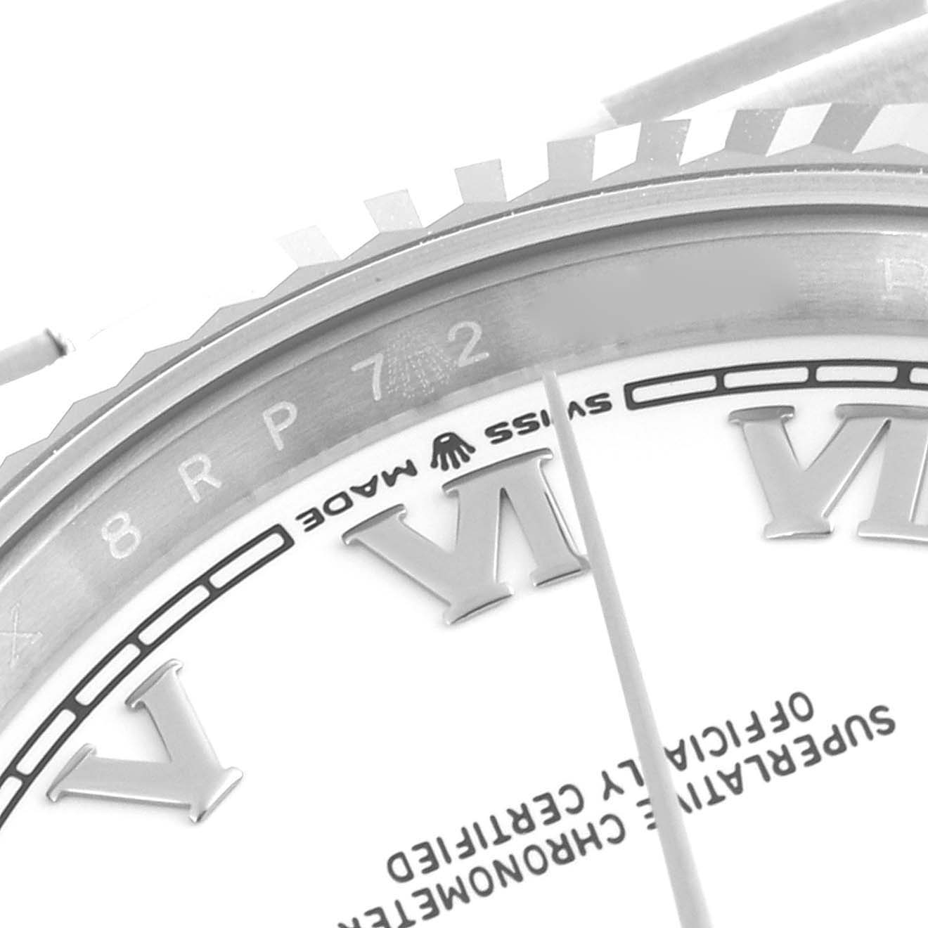 The image shows a close-up of the bezel and dial of a Rolex Datejust 126234 Men's Stainless Steel White Dial 126234 Men's Stainless Steel White Dial, highlighting the "SWISS MADE" text and Roman numeral markers.