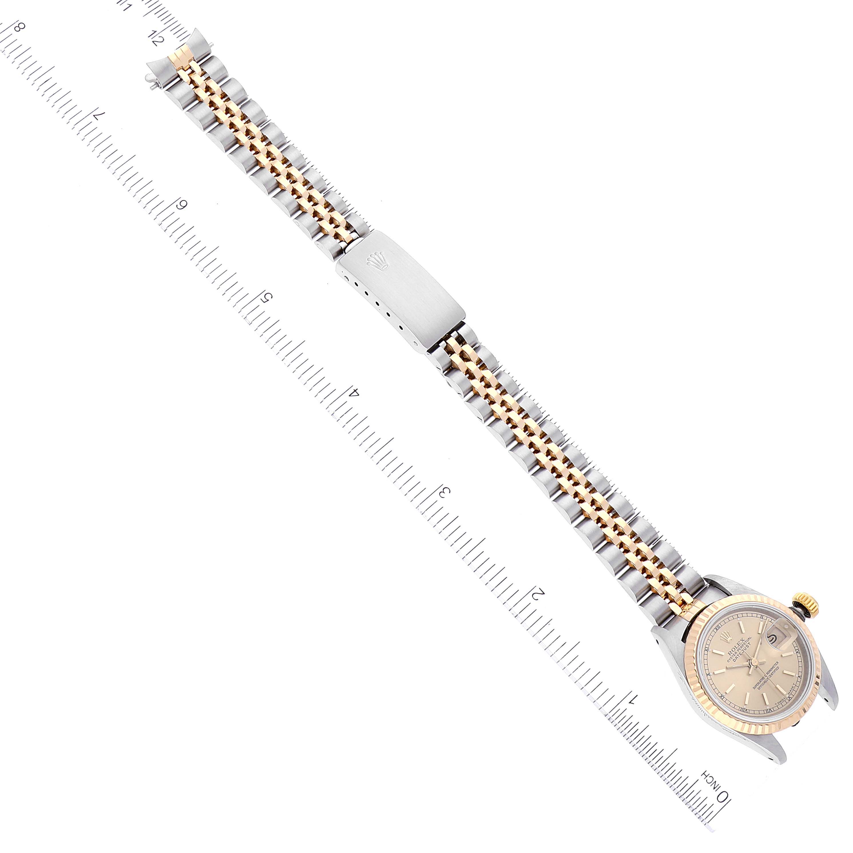 The image shows a top-down view of a Rolex Datejust 69173 Women's Steel and Gold (two tone) Champagne Dial 69173 Women's Steel and Gold (two tone) Champagne Dial watch laid out flat, displaying the entire watch and bracelet against a ruler for scale.