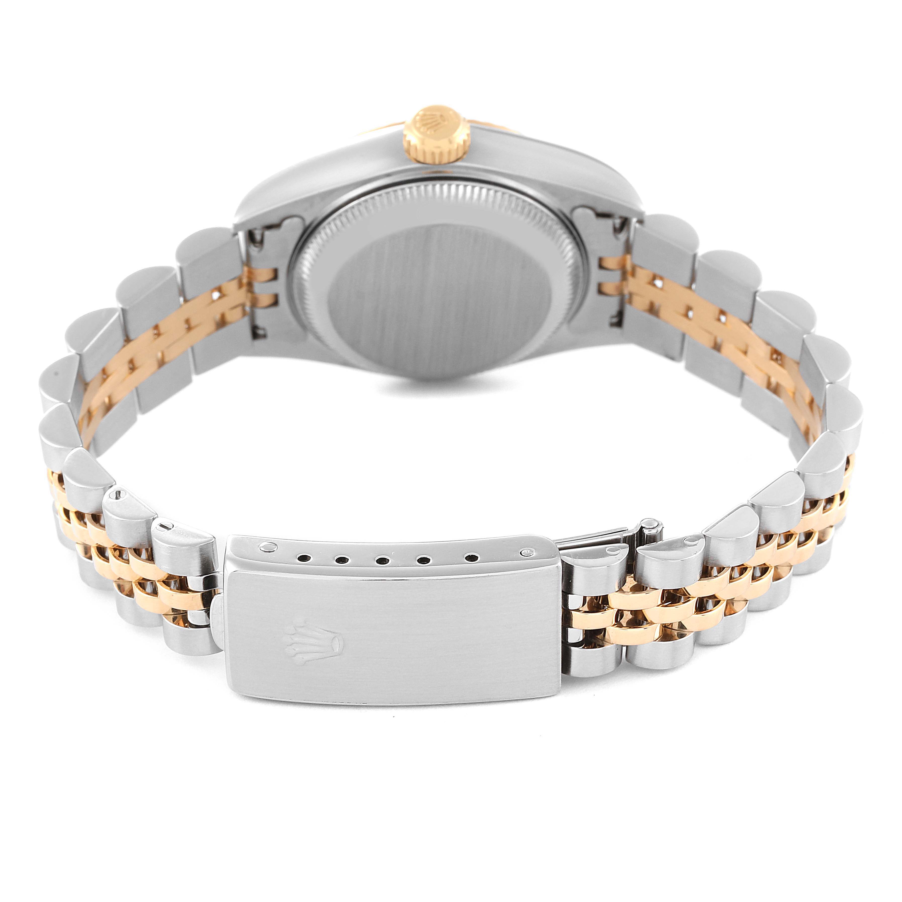 This image shows the back of a Rolex Datejust 79173 Women's Steel and Gold (two tone) Champagne Dial 79173 Women's Steel and Gold (two tone) Champagne Dial watch, highlighting its clasp, bracelet, and crown from a rear angle.