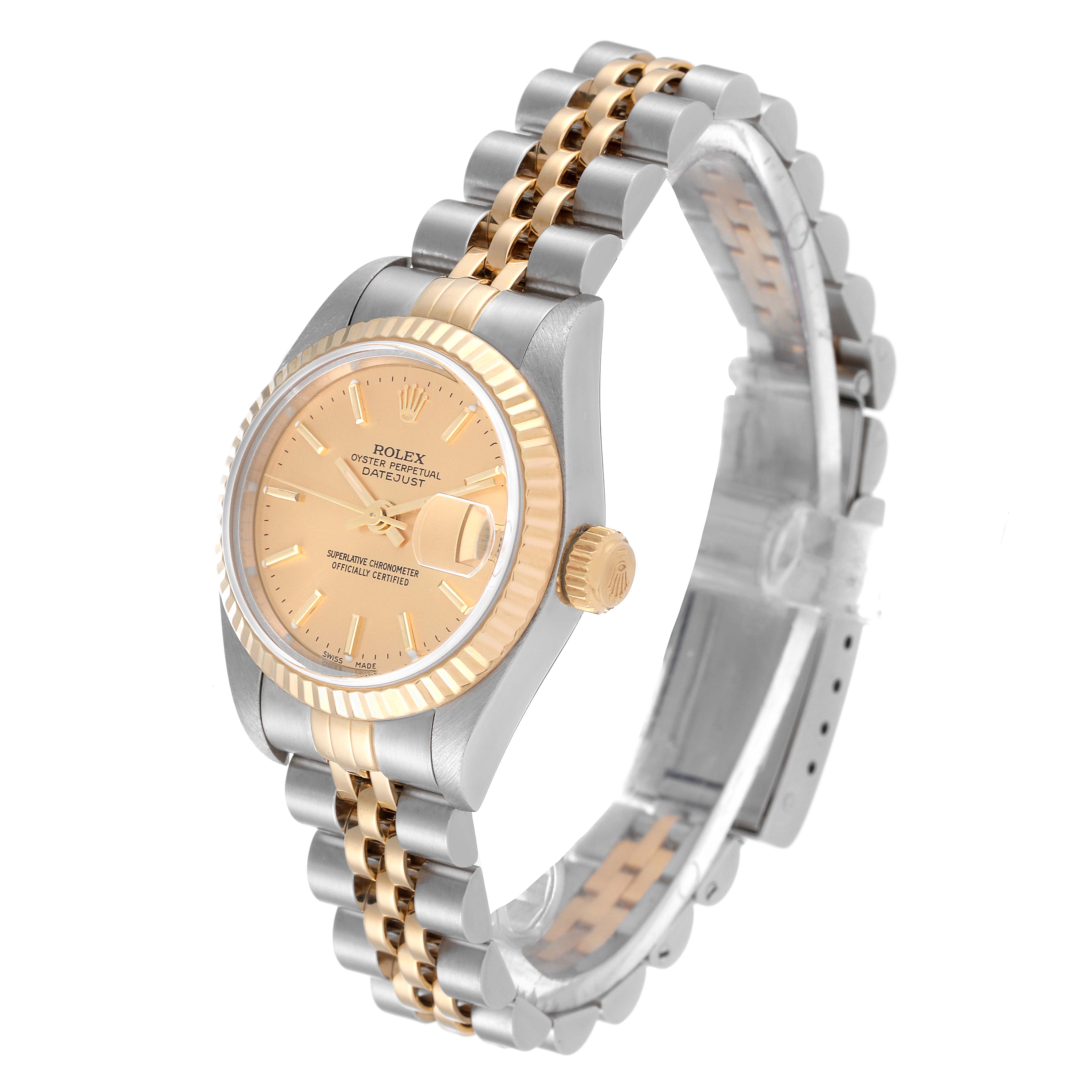 This Rolex Datejust 79173 Women's Steel and Gold (two tone) Champagne Dial 79173 Women's Steel and Gold (two tone) Champagne Dial watch is shown at a three-quarter angle, highlighting its champagne dial, fluted bezel, and two-tone bracelet.