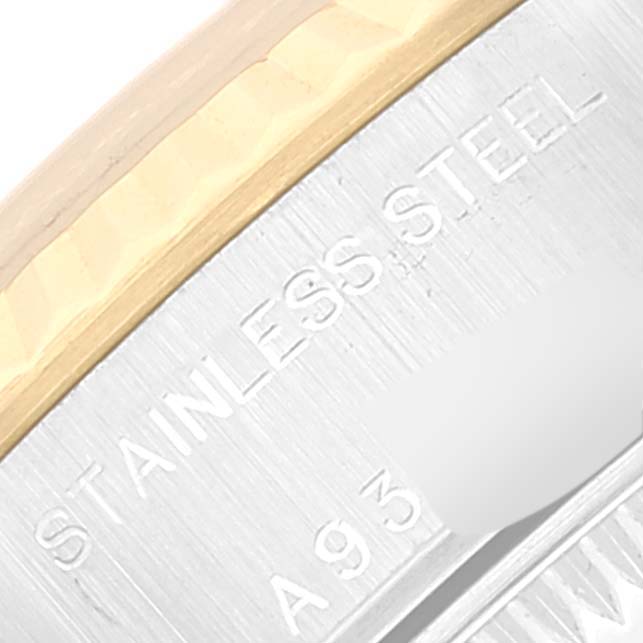 This close-up shows the stainless steel casing and an engraved serial number of a Rolex Datejust 79173 Women's Steel and Gold (two tone) Champagne Dial 79173 Women's Steel and Gold (two tone) Champagne Dial watch.