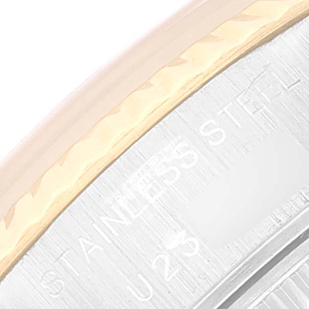 This close-up image shows the bezel and part of the case with engraved text of a Rolex Datejust 69173 Women's Steel and Gold (two tone) Beige Dial 69173 Women's Steel and Gold (two tone) Beige Dial watch.