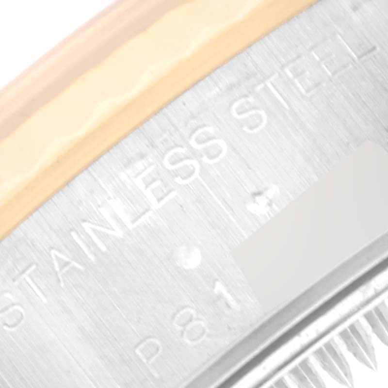 This close-up image shows the stainless steel case back and part of the gold bezel of a Rolex Datejust 79173 Women's Steel and Gold (two tone) White Dial 79173 Women's Steel and Gold (two tone) White Dial watch.