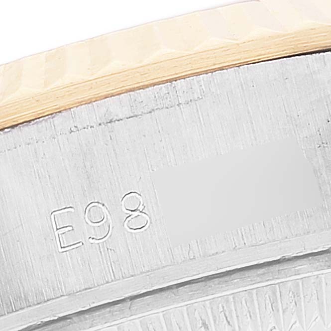 This image shows a close-up of the serial number engraved on the case of a Rolex Datejust 69173 Women's Steel and Gold (two tone) White Dial 69173 Women's Steel and Gold (two tone) White Dial watch.