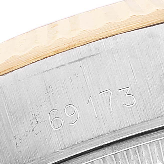 This image shows a close-up of the reference number "69173" engraved on the side of a Rolex Datejust 69173 Women's Steel and Gold (two tone) White Dial 69173 Women's Steel and Gold (two tone) White Dial case.