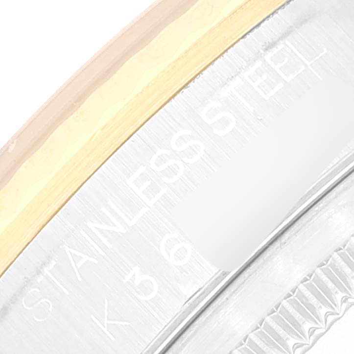 This image shows a close-up of the side and edge of the case back of a Rolex Datejust 16233 Men's Steel and Gold (two tone) White Dial 16233 Men's Steel and Gold (two tone) White Dial watch.