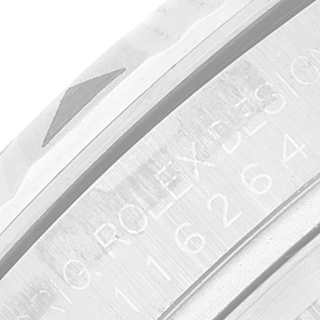 This image shows a close-up of the bezel and part of the engraved case of the Rolex Turn-o-Graph 116264 Men's Stainless Steel Blue Dial 116264 Men's Stainless Steel Blue Dial model watch.