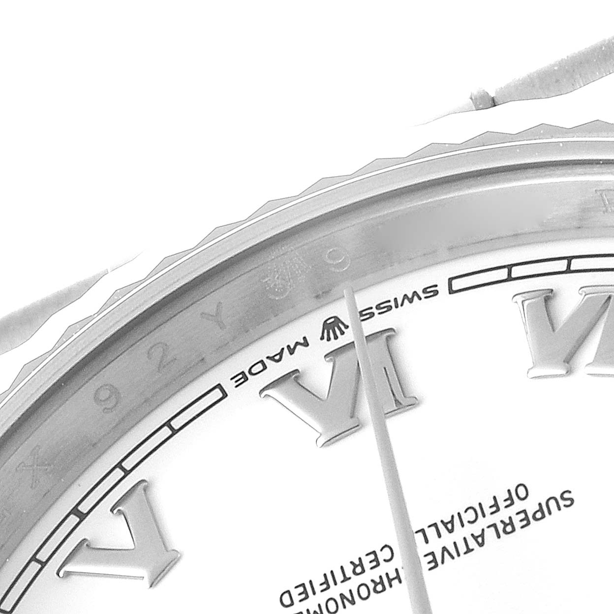 This image shows a close-up of the face and bezel of a Rolex President 128239 Men's White Gold White Dial 128239 Men's White Gold White Dial model watch.