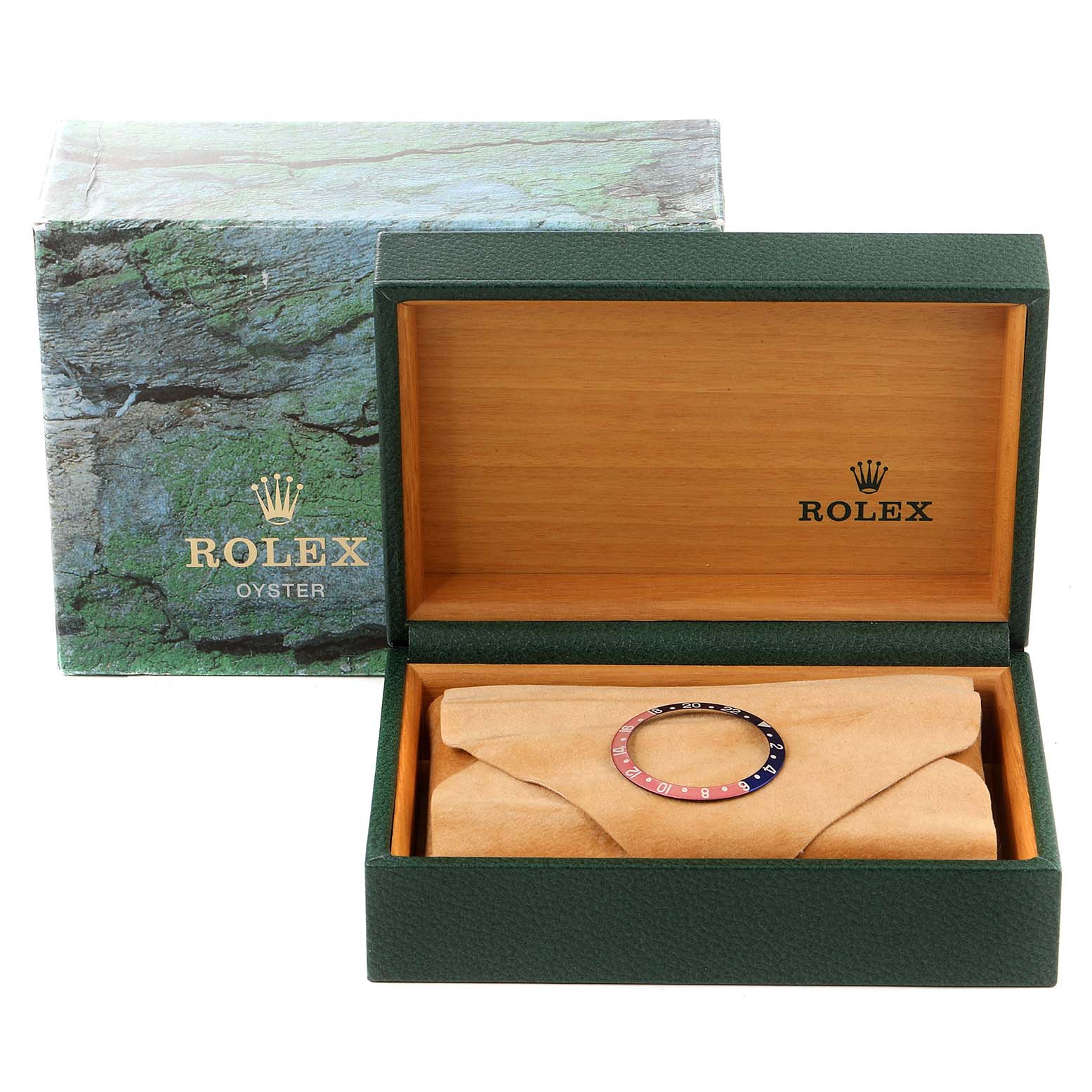 The image shows the bezel of a Rolex GMT-Master 16710 Men
s Stainless Steel Black Dial 16710 Men
s Stainless Steel Black Dial watch inside its open box with the outer packaging also visible.