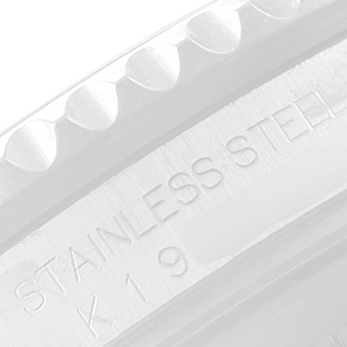 The image shows a close-up of the case side of a Rolex GMT-Master 16710 Men
s Stainless Steel Black Dial 16710 Men
s Stainless Steel Black Dial watch, highlighting its "STAINLESS STEEL" engraving.