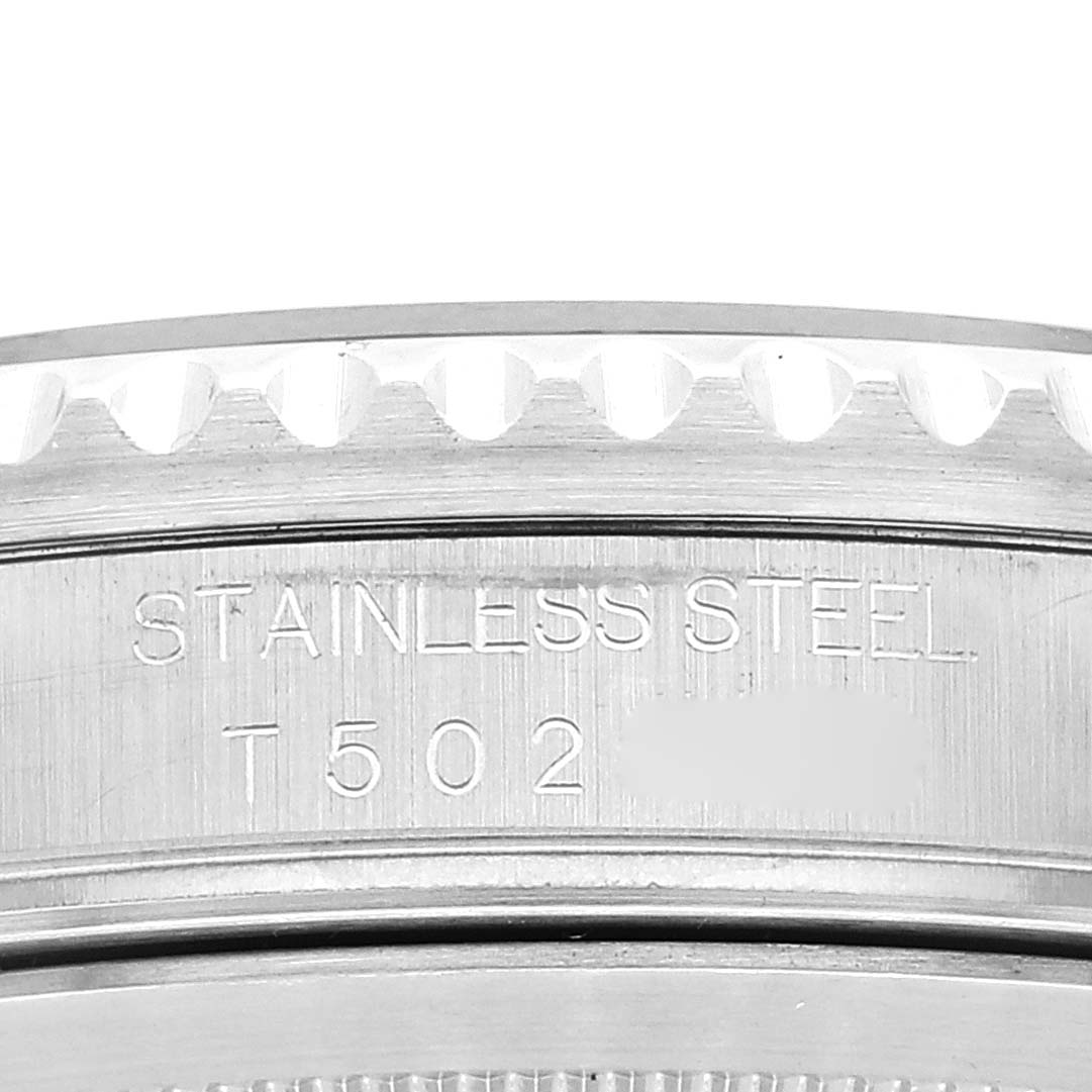 This image shows the side of the bezel and part of the case back of the Rolex GMT-Master 16710 Men
s Stainless Steel Black Dial 16710 Men
s Stainless Steel Black Dial, highlighting the "Stainless Steel" engraving.