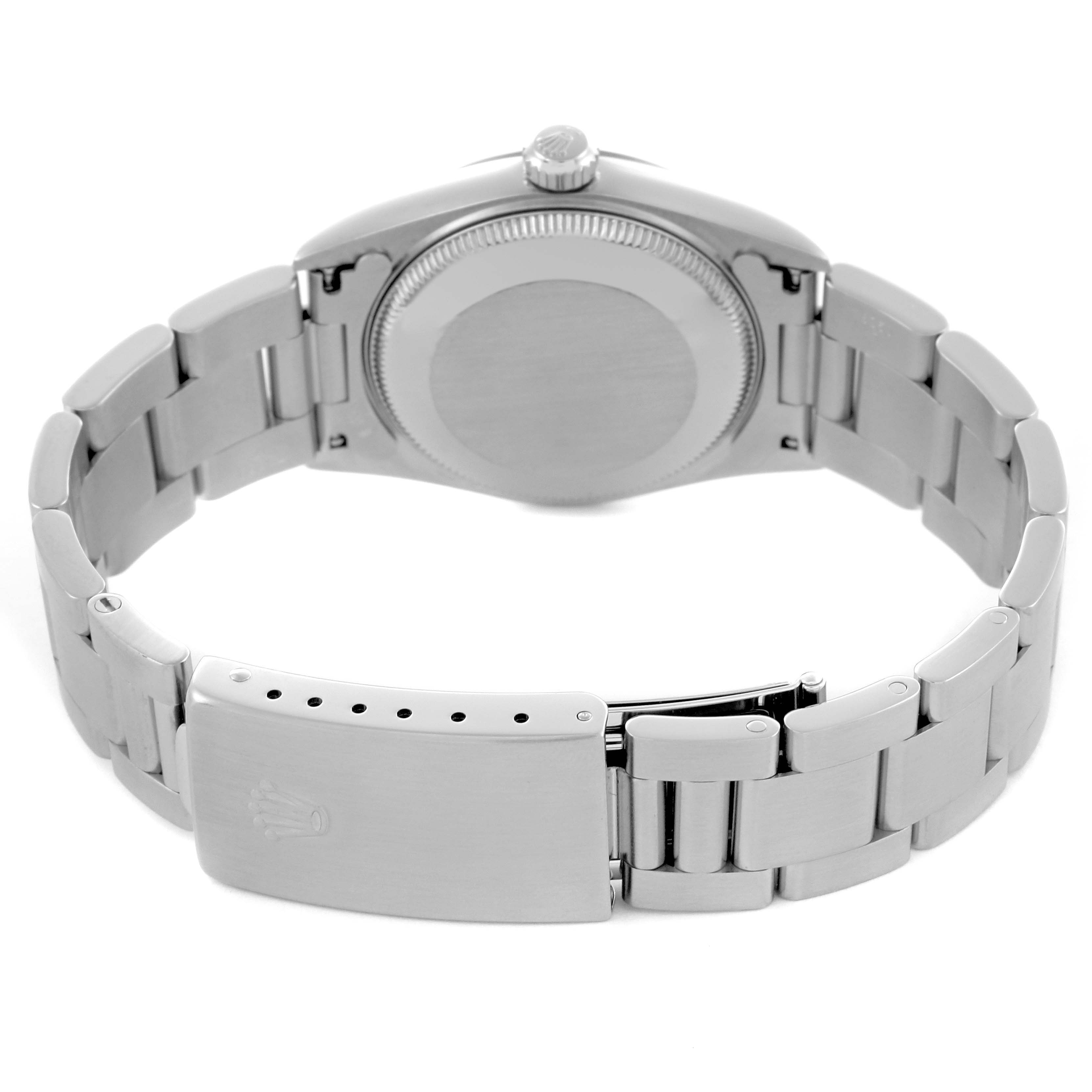 The image shows the back view of a Rolex Mid-Size 67480 Women's Stainless Steel Silver Dial 67480 Women's Stainless Steel Silver Dial model with the bracelet and clasp visible.